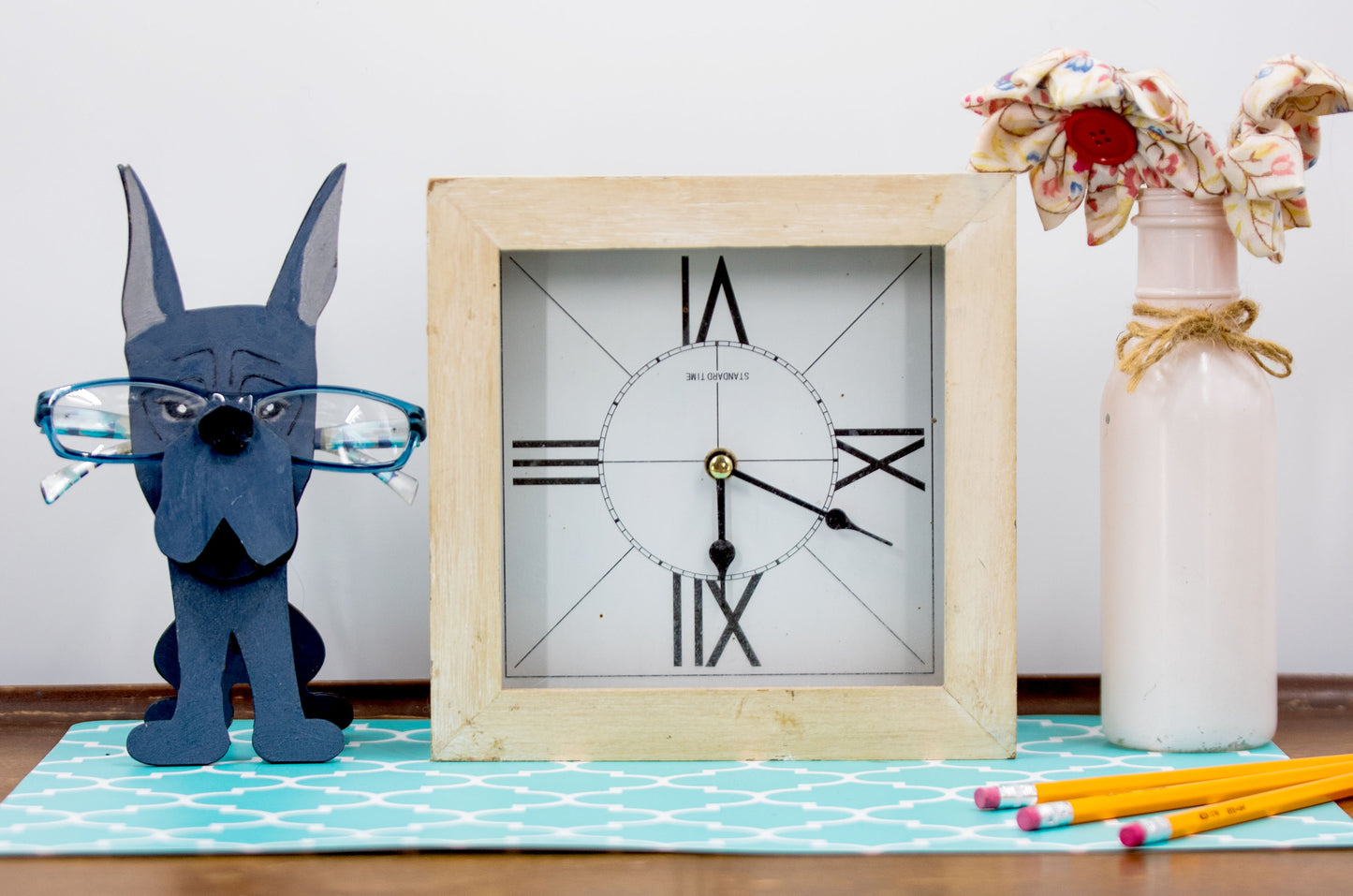 A handcrafted wooden Great Dane eyeglasses holder designed to resemble the iconic breed, available with floppy or docked ears. Comes in black, blue, fawn, or detailed mantle coloring. Floppy ear version measures 6.35" tall by 4.35" wide; docked ear version stands 8.5" tall by 3.15" wide. Perfect for organizing glasses on desks or nightstands, and makes a great gift for Great Dane lovers.
