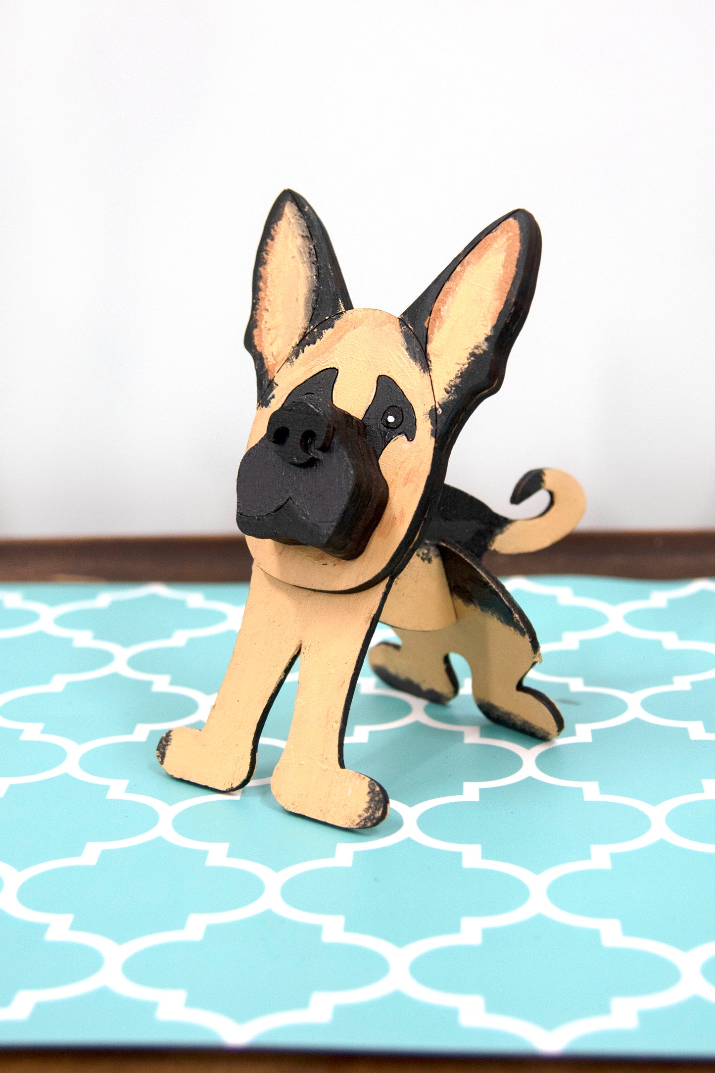 Handmade wooden German Shepherd glasses holder, crafted with carved facial details and a secure snout-shaped rest for eyeglasses. Finished in rustic paint tones with optional personalization, this dog-shaped stand is both a charming gift and a functional decor piece for pet lovers, especially German Shepherd owners. Ideal for desks, nightstands, or entry tables.