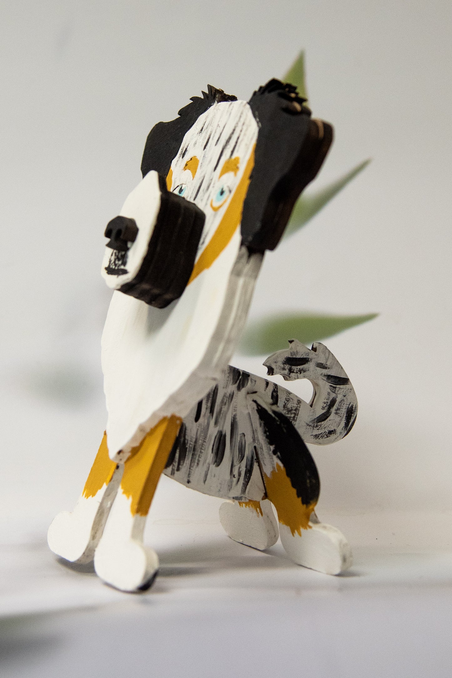 Paint-your-own Australian Shepherd glasses stand DIY kit, made from laser-cut wood in a sitting dog shape, with separate pieces for easy assembly. Includes instructions and optional paint add-on. A fun craft project for dog lovers, pet parents, or kids.