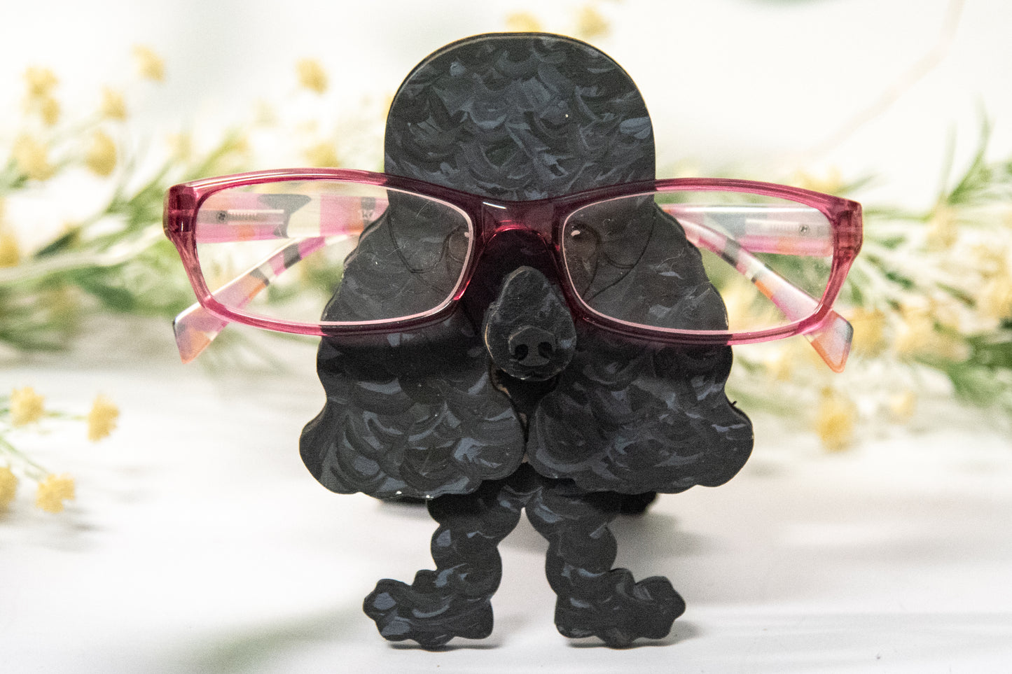 Handcrafted wooden poodle glasses holder stand in standard or miniature poodle shape, with optional bow detail, shown in black and white but fully customizable, unique dog lover gift