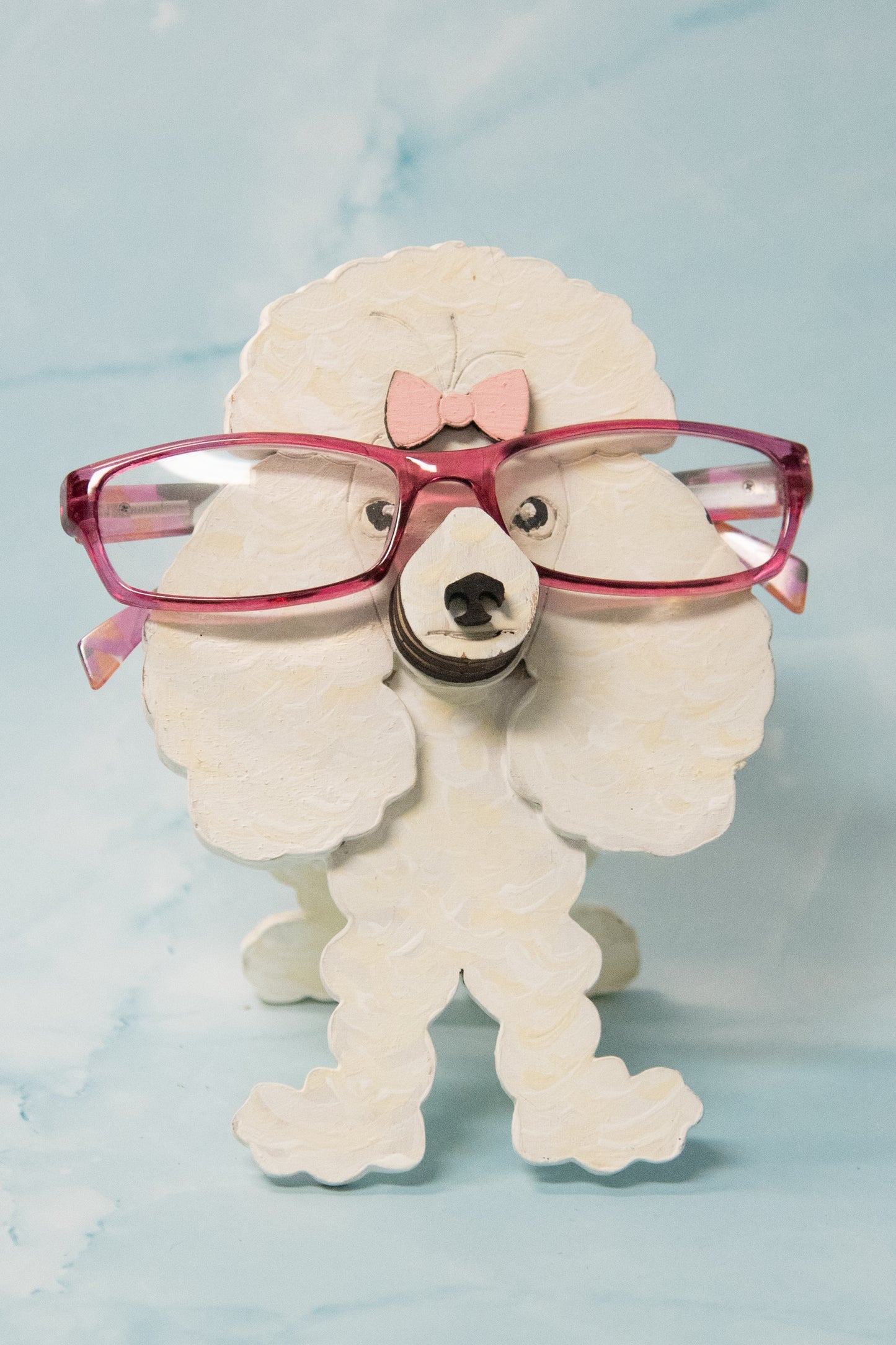 Handcrafted wooden poodle glasses holder stand in standard or miniature poodle shape, with optional bow detail, shown in black and white but fully customizable, unique dog lover gift
