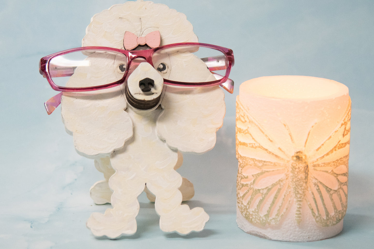Handcrafted wooden poodle glasses holder stand in standard or miniature poodle shape, with optional bow detail, shown in black and white but fully customizable, unique dog lover gift