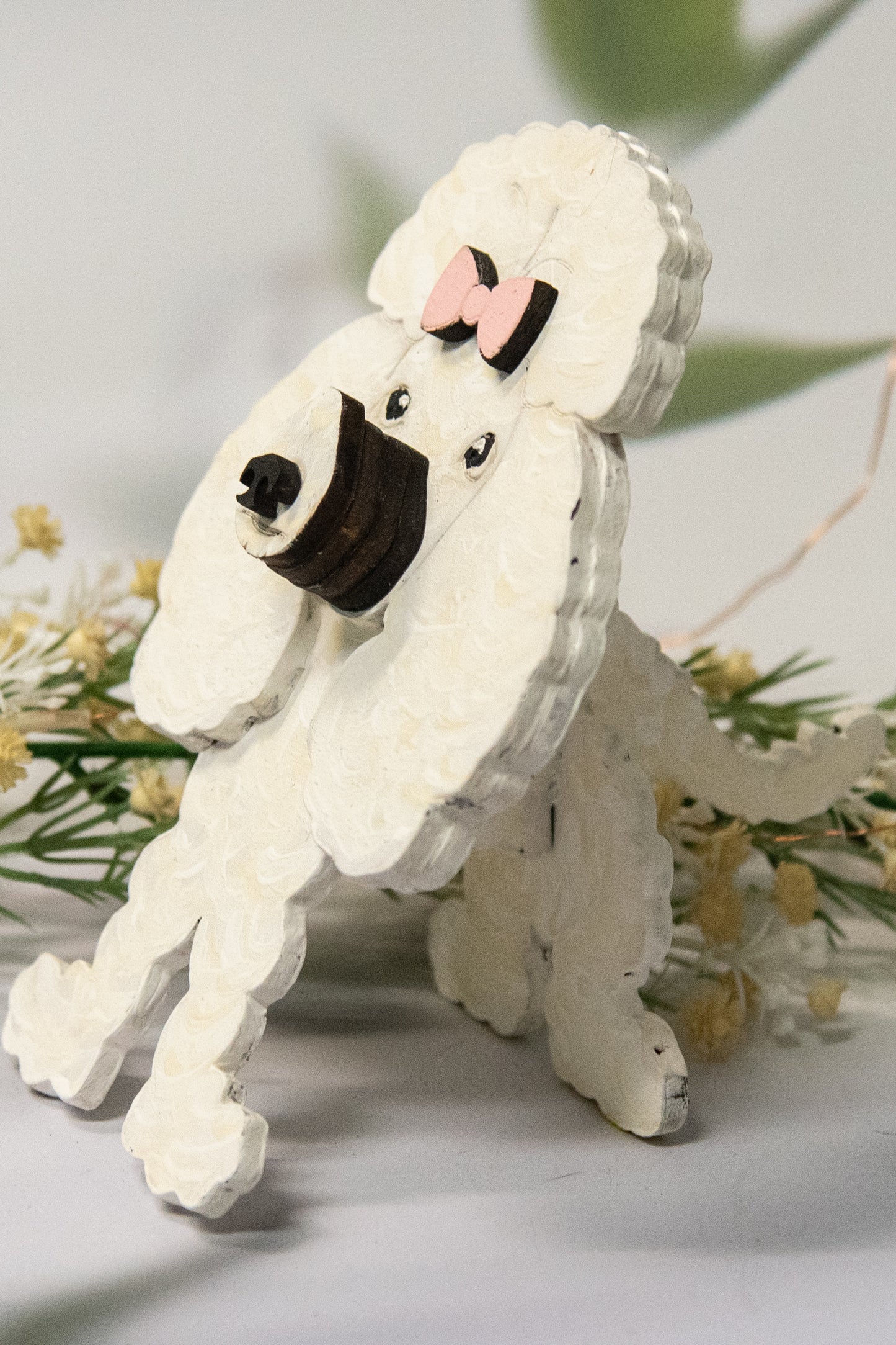 Handcrafted wooden poodle glasses holder stand in standard or miniature poodle shape, with optional bow detail, shown in black and white but fully customizable, unique dog lover gift