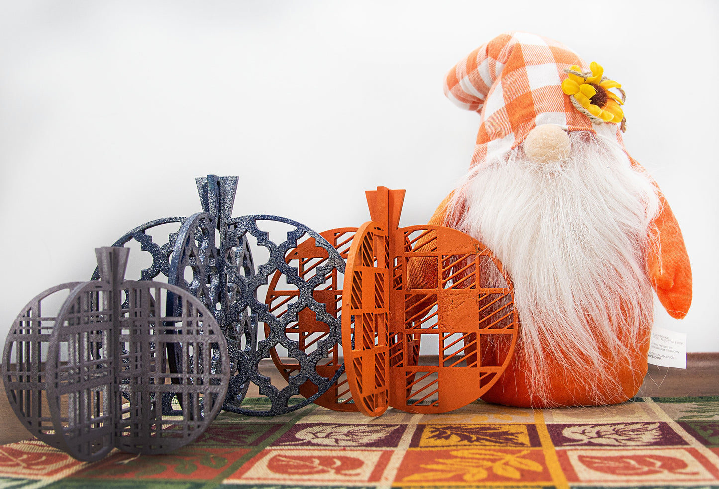 A handcrafted set of 3D wooden pumpkins designed to slot together and stand upright, perfect for Halloween or fall home decor. Each pumpkin features layered wood details and a freestanding base. Great for shelf styling, entry tables, tiered trays, or Thanksgiving centerpieces.
