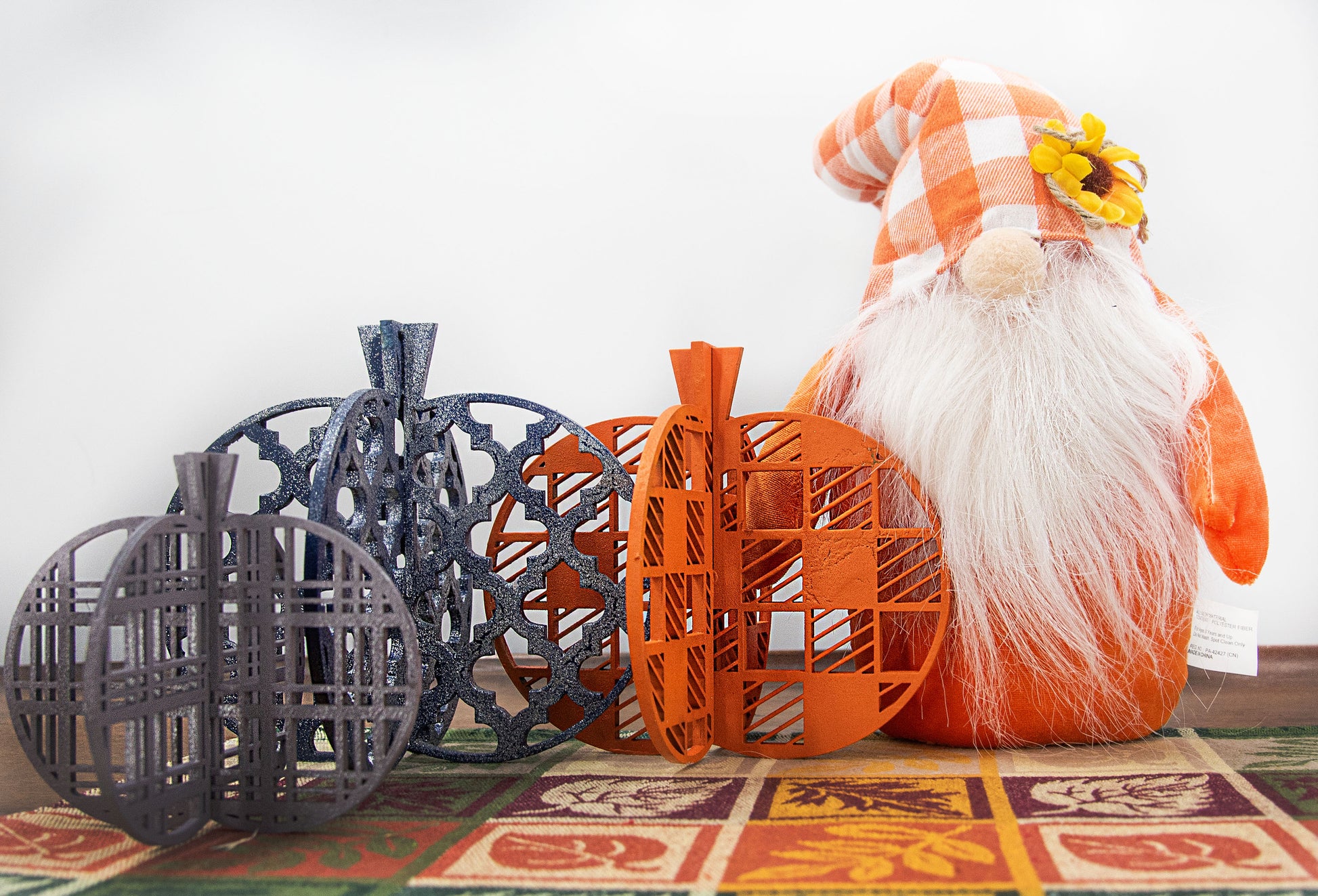 A handcrafted set of 3D wooden pumpkins designed to slot together and stand upright, perfect for Halloween or fall home decor. Each pumpkin features layered wood details and a freestanding base. Great for shelf styling, entry tables, tiered trays, or Thanksgiving centerpieces.
