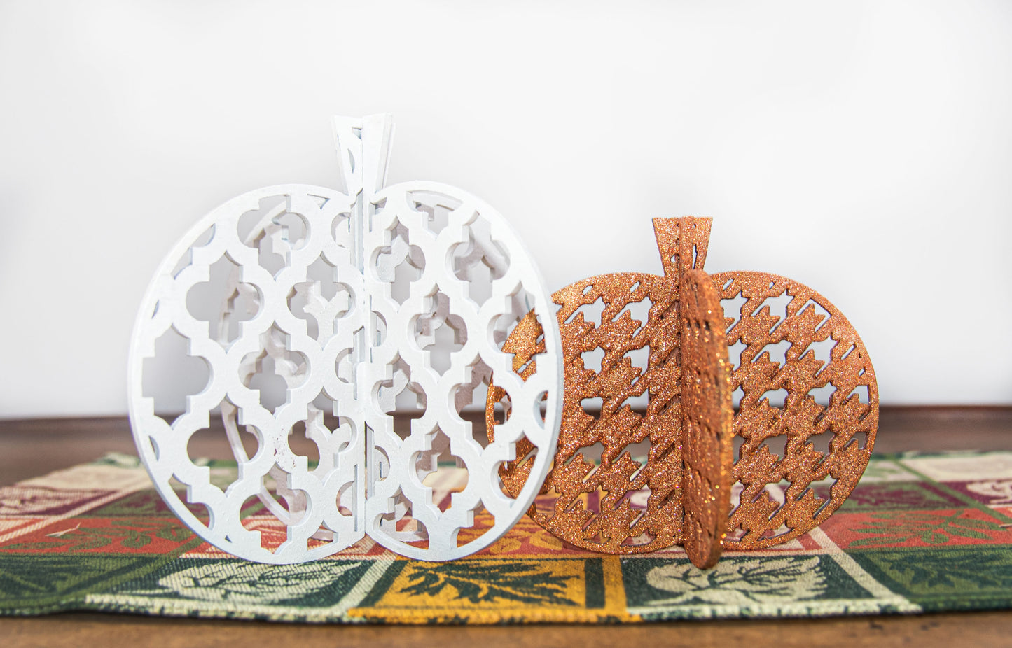 A handcrafted set of 3D wooden pumpkins designed to slot together and stand upright, perfect for Halloween or fall home decor. Each pumpkin features layered wood details and a freestanding base. Great for shelf styling, entry tables, tiered trays, or Thanksgiving centerpieces.
