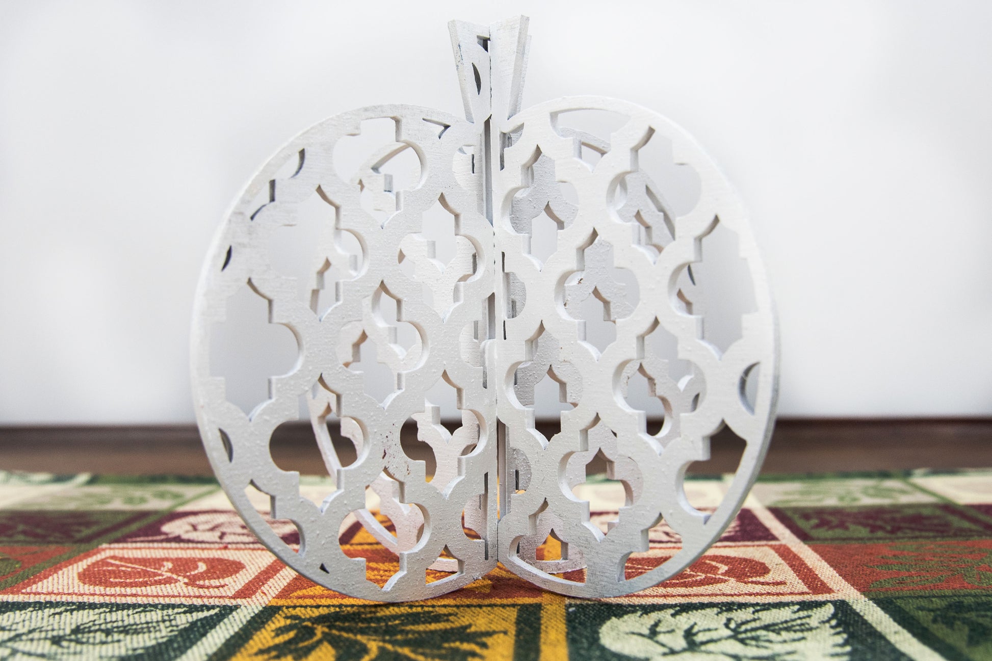 A handcrafted set of 3D wooden pumpkins designed to slot together and stand upright, perfect for Halloween or fall home decor. Each pumpkin features layered wood details and a freestanding base. Great for shelf styling, entry tables, tiered trays, or Thanksgiving centerpieces.
