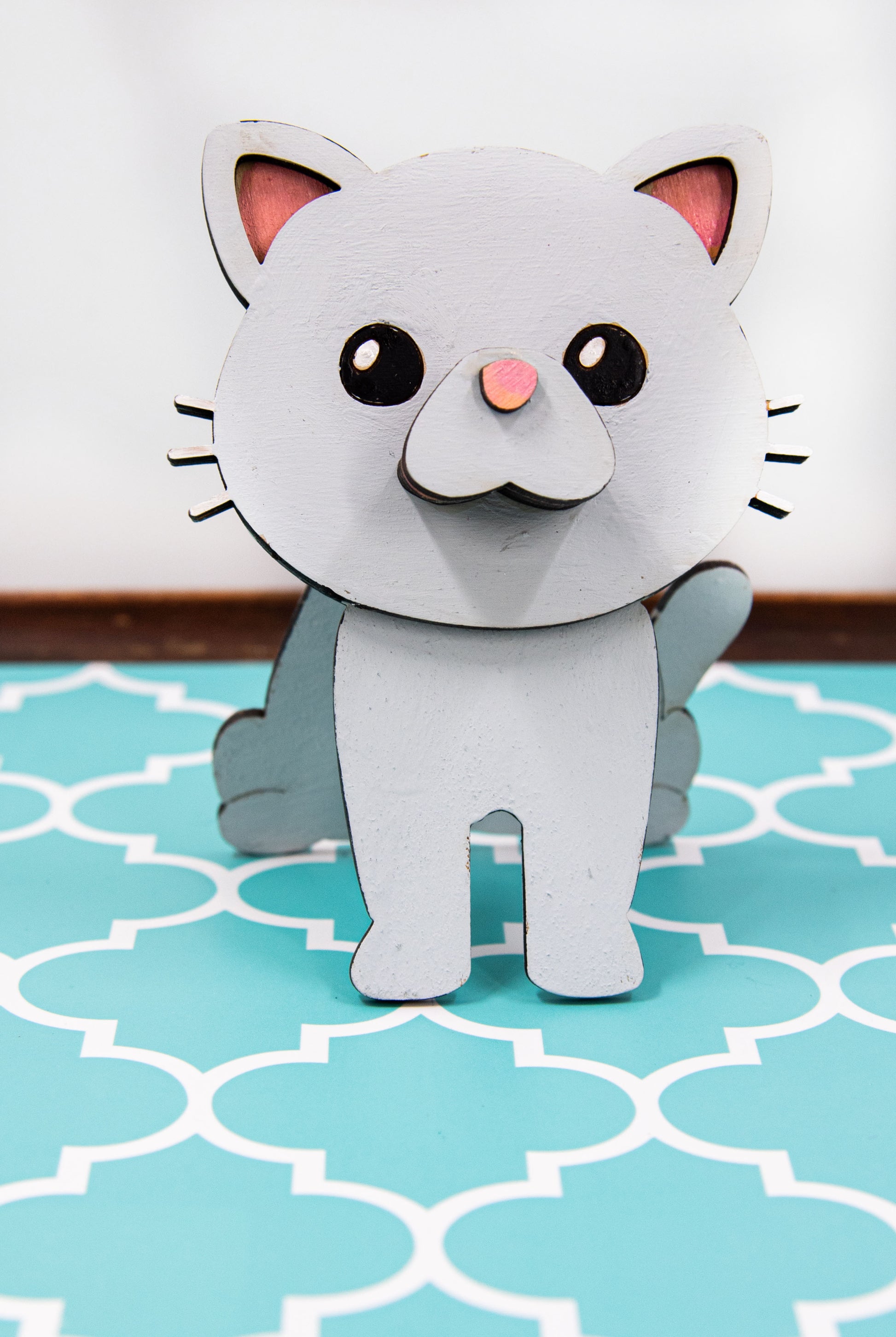 Custom-painted wooden cat glasses holder shaped like a sitting cat with eyeglasses resting on its nose. Available in black, white, orange, gray, tabby, Siamese, tuxedo, or painted from your cat's photo with optional name personalization.