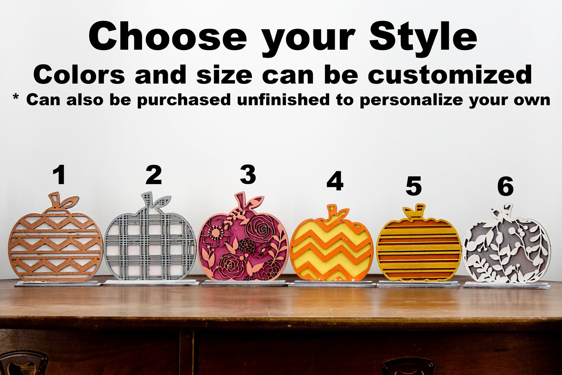 Layered standing wooden pumpkins ranging from 5.5 to 8 inches tall, featuring a solid color background and patterned top layer in assorted fall colors and rustic prints. Some designs include engraved words like 'Blessed' and 'Grateful.' Each pumpkin stands on a wooden base, making them ideal for fall shelf decor, Thanksgiving displays, or farmhouse-style seasonal arrangements.