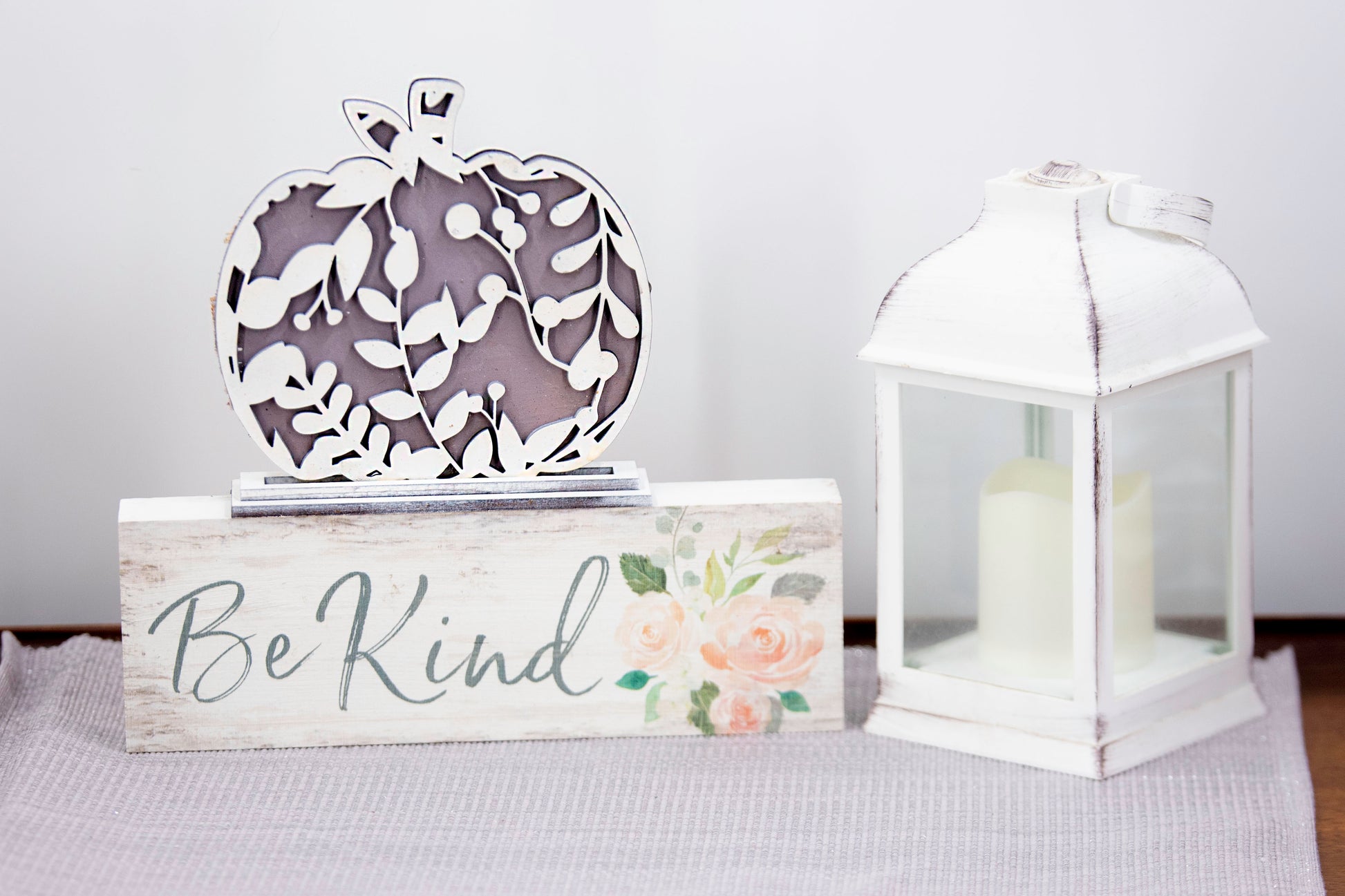Layered standing wooden pumpkins ranging from 5.5 to 8 inches tall, featuring a solid color background and patterned top layer in assorted fall colors and rustic prints. Some designs include engraved words like 'Blessed' and 'Grateful.' Each pumpkin stands on a wooden base, making them ideal for fall shelf decor, Thanksgiving displays, or farmhouse-style seasonal arrangements.