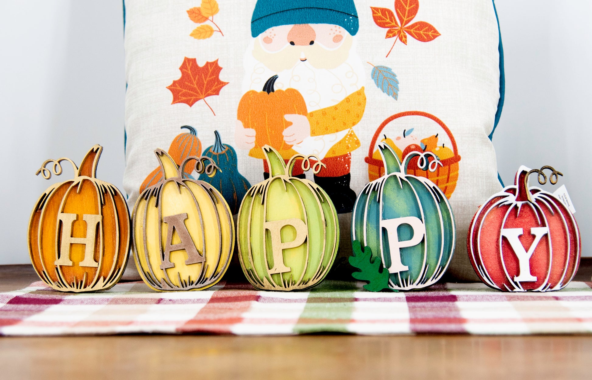 Custom standing wood pumpkins designed as individual letters to spell out names, fall words, or seasonal phrases. Each letter is crafted into a 3D pumpkin shape with intricate etched details, layered for dimension, and hand-painted in your choice of autumn colors. These personalized shelf sitters range in size from 3 to 6.5 inches and are perfect for mantels, entry tables, tiered trays, classrooms, or Thanksgiving displays. Ideal for gifting or adding a festive touch to your home.
