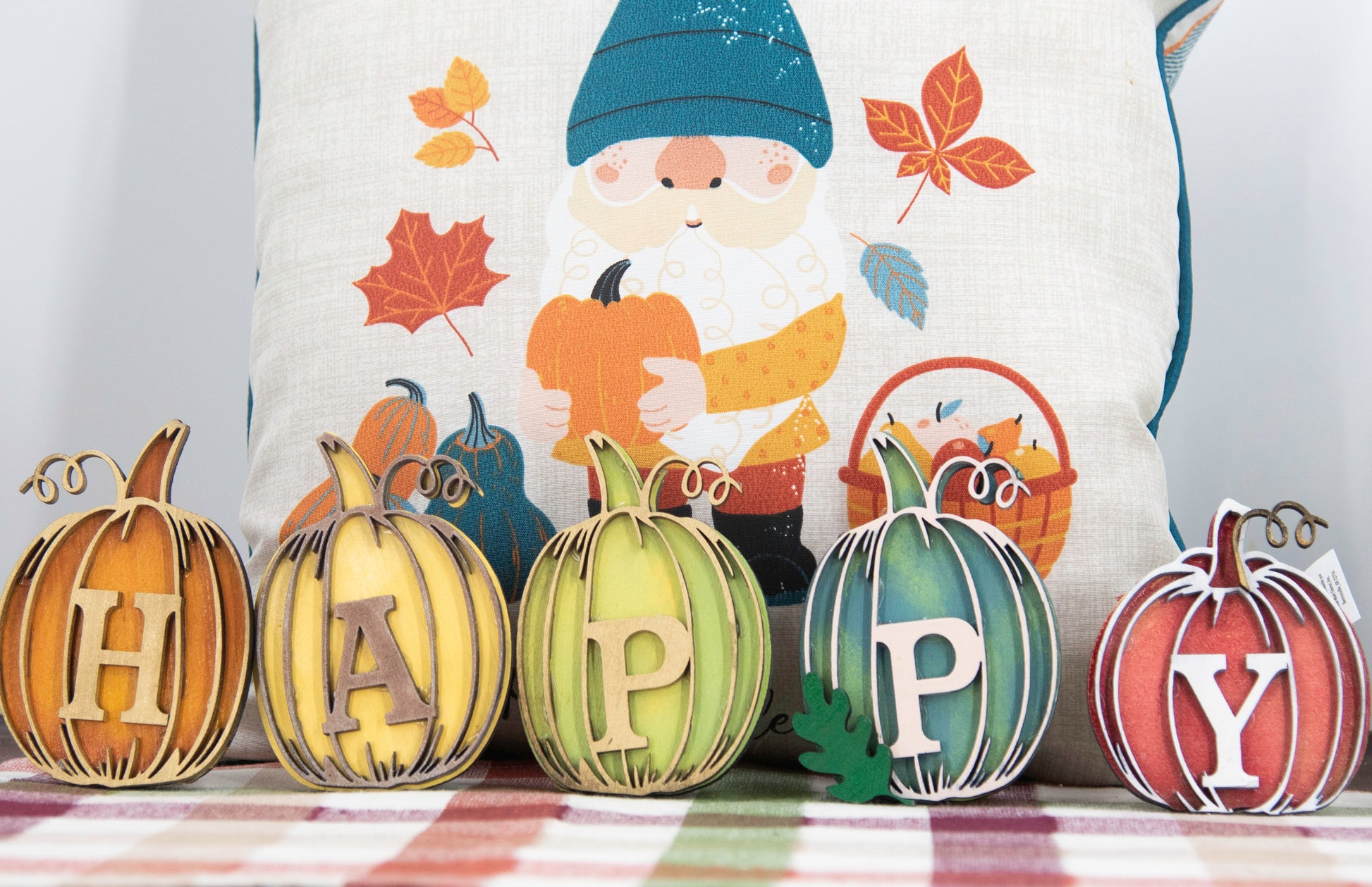 Custom standing wood pumpkins designed as individual letters to spell out names, fall words, or seasonal phrases. Each letter is crafted into a 3D pumpkin shape with intricate etched details, layered for dimension, and hand-painted in your choice of autumn colors. These personalized shelf sitters range in size from 3 to 6.5 inches and are perfect for mantels, entry tables, tiered trays, classrooms, or Thanksgiving displays. Ideal for gifting or adding a festive touch to your home.
