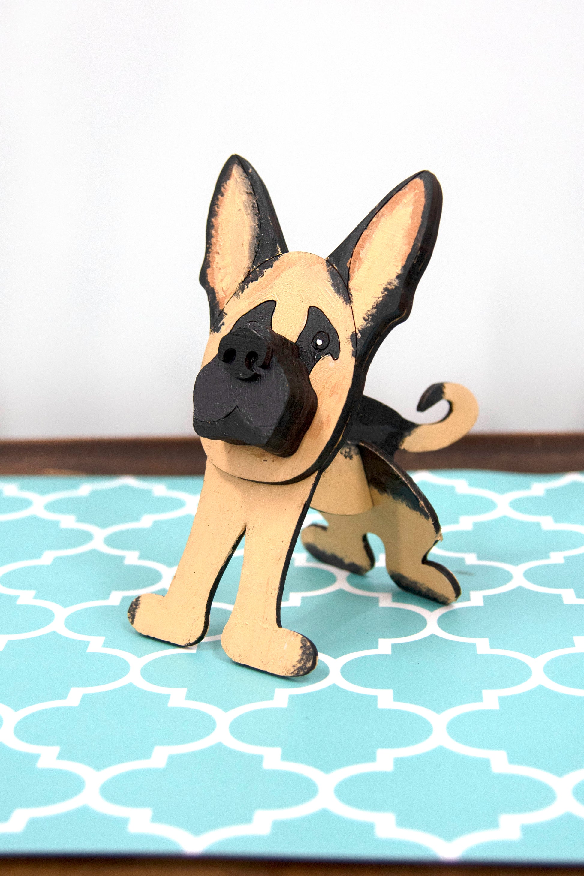 Handmade wooden German Shepherd glasses holder, crafted with carved facial details and a secure snout-shaped rest for eyeglasses. Finished in rustic paint tones with optional personalization, this dog-shaped stand is both a charming gift and a functional decor piece for pet lovers, especially German Shepherd owners. Ideal for desks, nightstands, or entry tables.