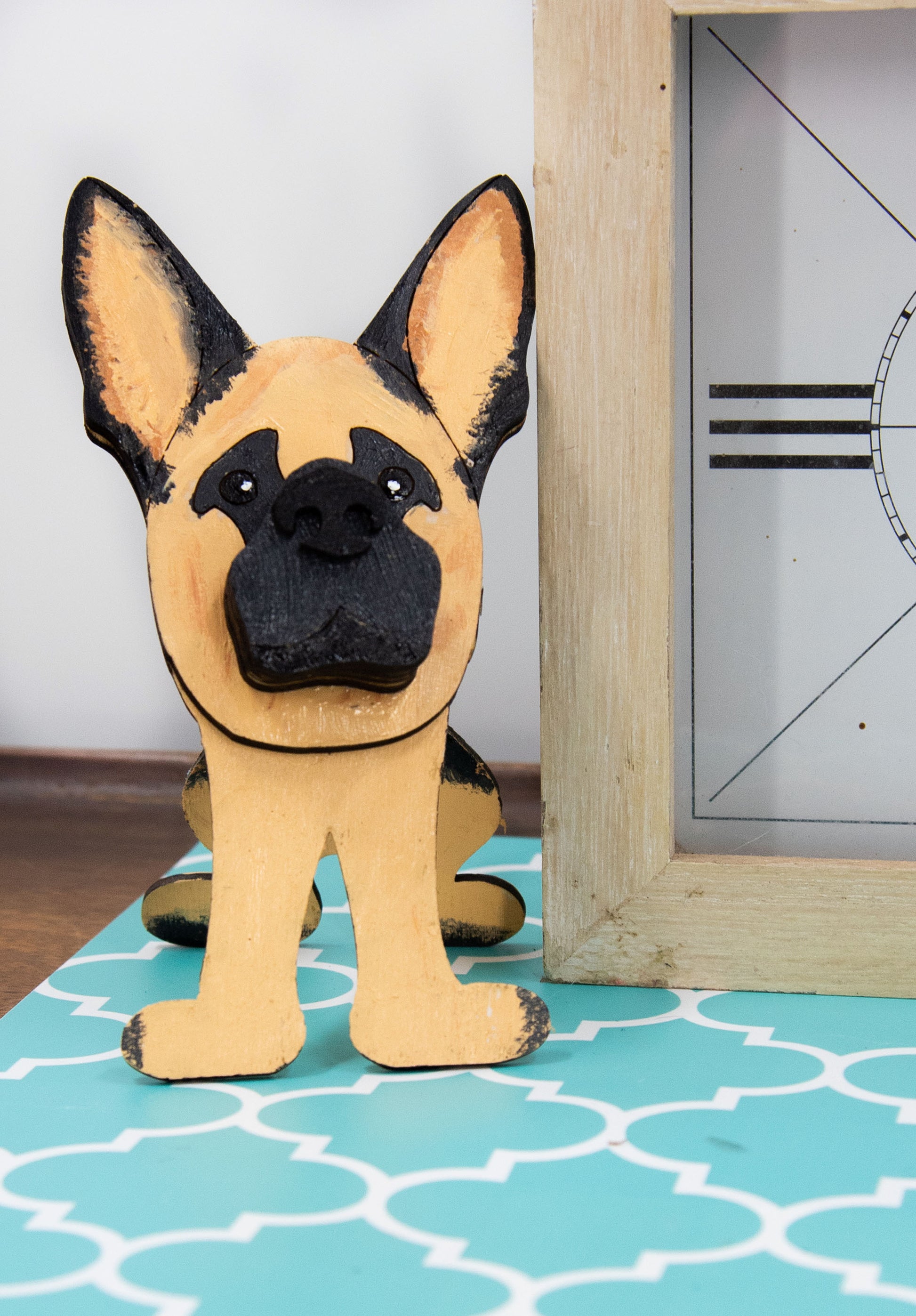 Handmade wooden German Shepherd glasses holder, crafted with carved facial details and a secure snout-shaped rest for eyeglasses. Finished in rustic paint tones with optional personalization, this dog-shaped stand is both a charming gift and a functional decor piece for pet lovers, especially German Shepherd owners. Ideal for desks, nightstands, or entry tables.