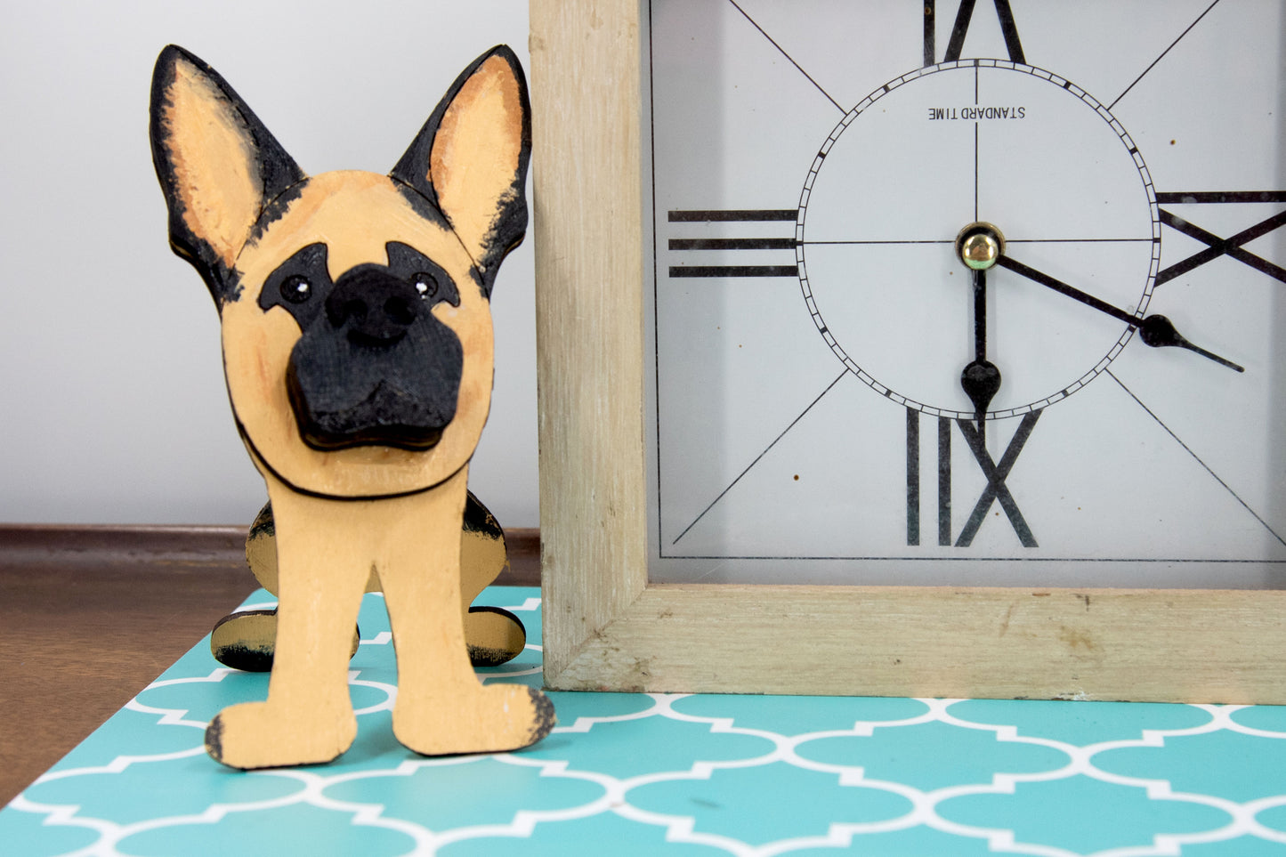 Handmade wooden German Shepherd glasses holder, crafted with carved facial details and a secure snout-shaped rest for eyeglasses. Finished in rustic paint tones with optional personalization, this dog-shaped stand is both a charming gift and a functional decor piece for pet lovers, especially German Shepherd owners. Ideal for desks, nightstands, or entry tables.