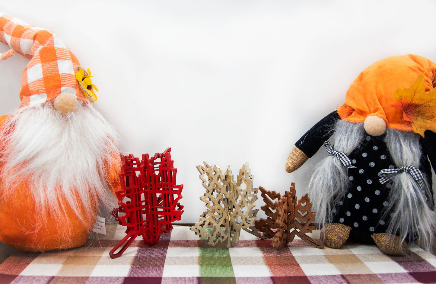 Freestanding 3D wooden leaf shelf sitters crafted with an interlocking two-piece design, painted in warm autumn colors such as orange, red, yellow, and brown. Each leaf features intricate engraved patterns and textures, making them perfect for seasonal tiered trays, mantels, or fall-themed centerpieces. Sizes range from 3 to 5.5 inches tall, with customizable color options for a unique, rustic autumn decor touch.
