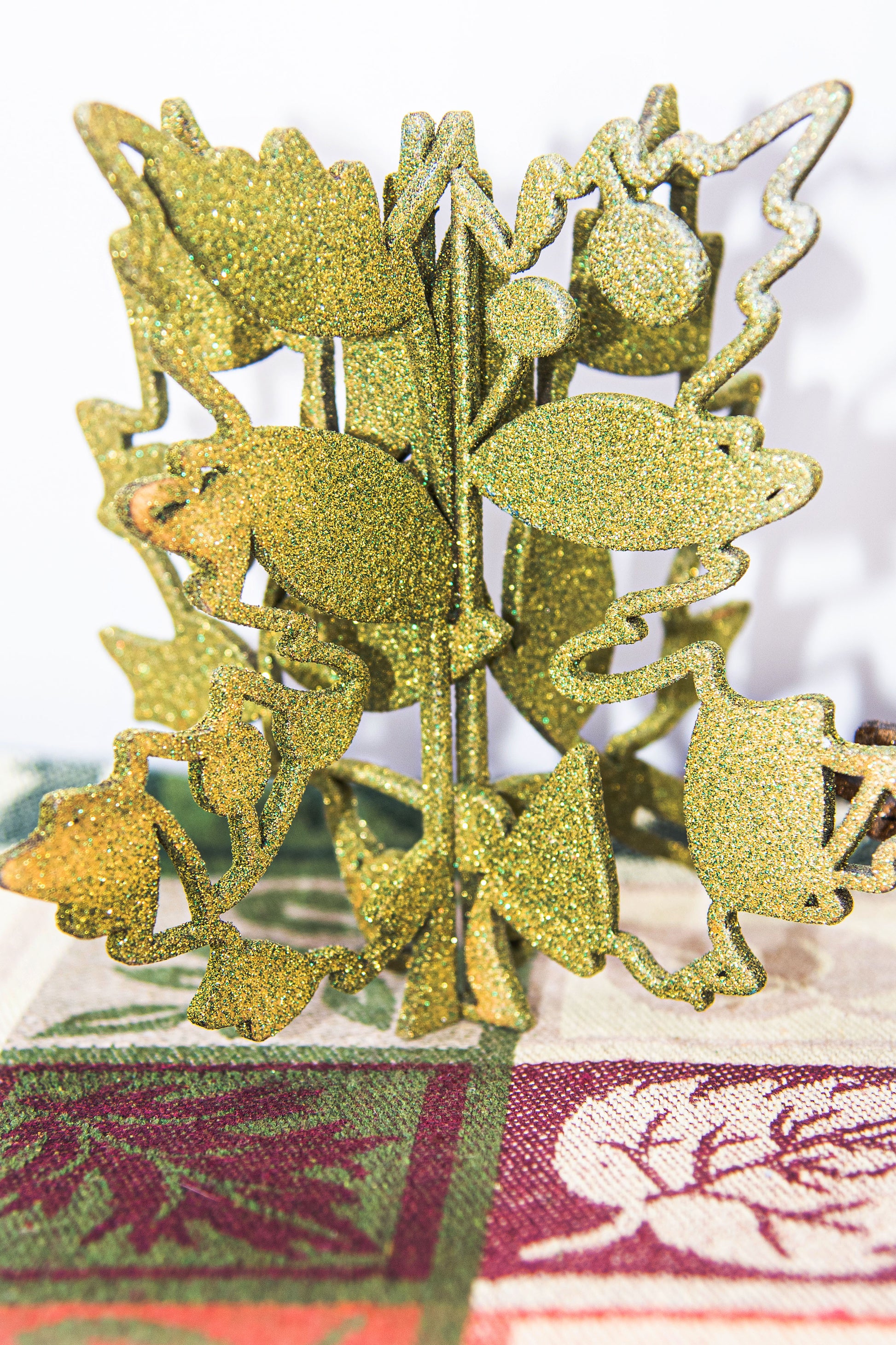 Freestanding 3D wooden leaf shelf sitters crafted with an interlocking two-piece design, painted in warm autumn colors such as orange, red, yellow, and brown. Each leaf features intricate engraved patterns and textures, making them perfect for seasonal tiered trays, mantels, or fall-themed centerpieces. Sizes range from 3 to 5.5 inches tall, with customizable color options for a unique, rustic autumn decor touch.
