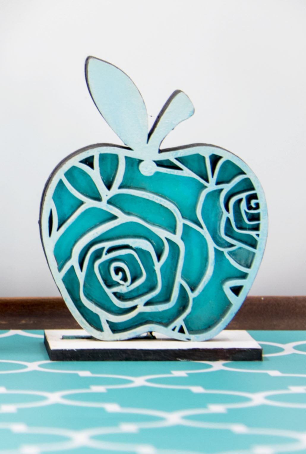 A handcrafted set of three standing wooden apple shelf sitters in assorted fall colors and patterns. These tiered tray-ready decorations include a rustic base and patterned top layer. Available individually or as a complete set, they bring warmth and charm to autumn home decor, classroom displays, or teacher gifts. Sizes range from 3.75" to 5.5".

