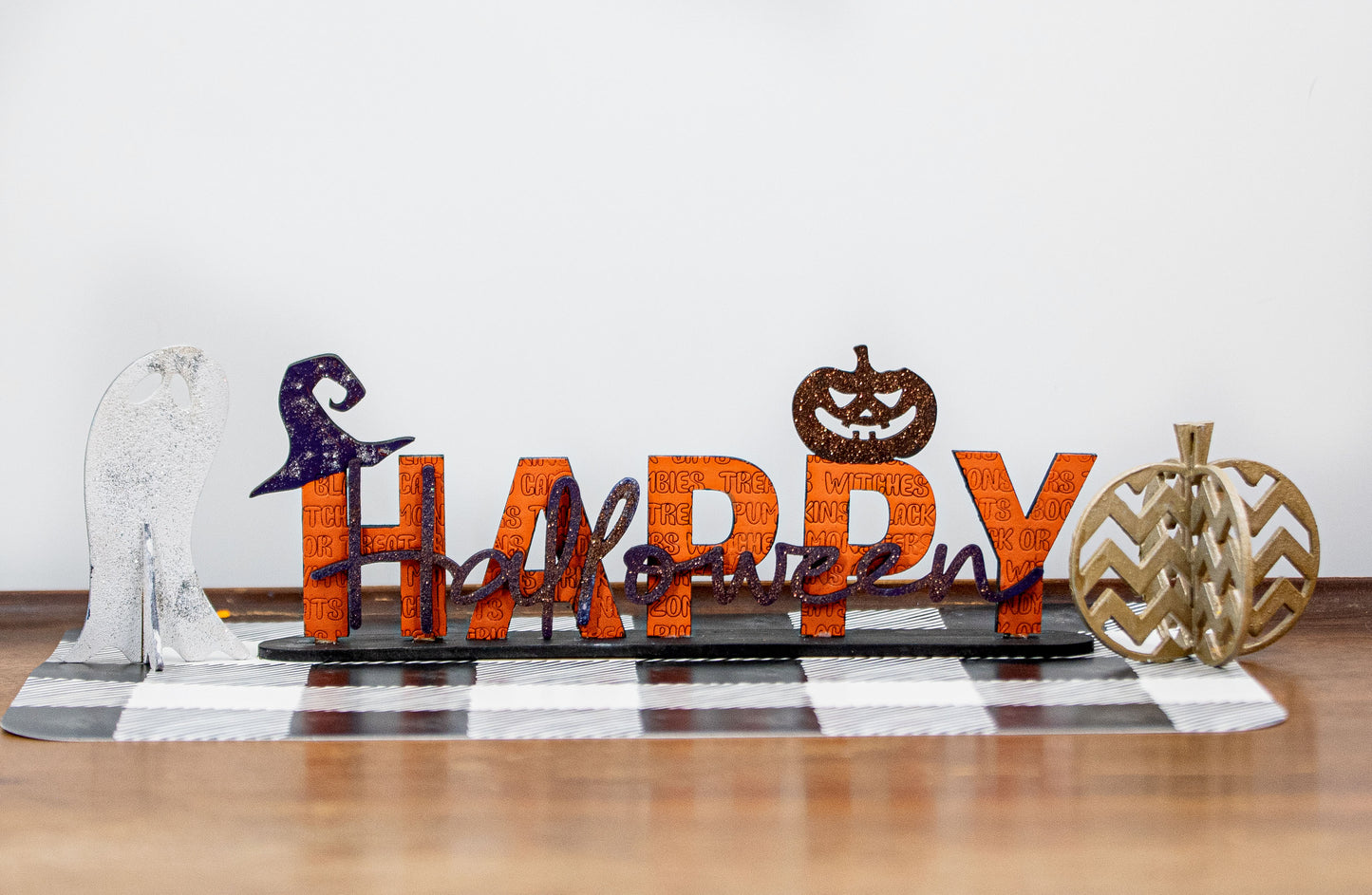 Happy Halloween wooden shelf sitter sign in festive spooky colors, laser-cut layered wood, free-standing design for mantels, shelves, or tiered tray fall decor.
