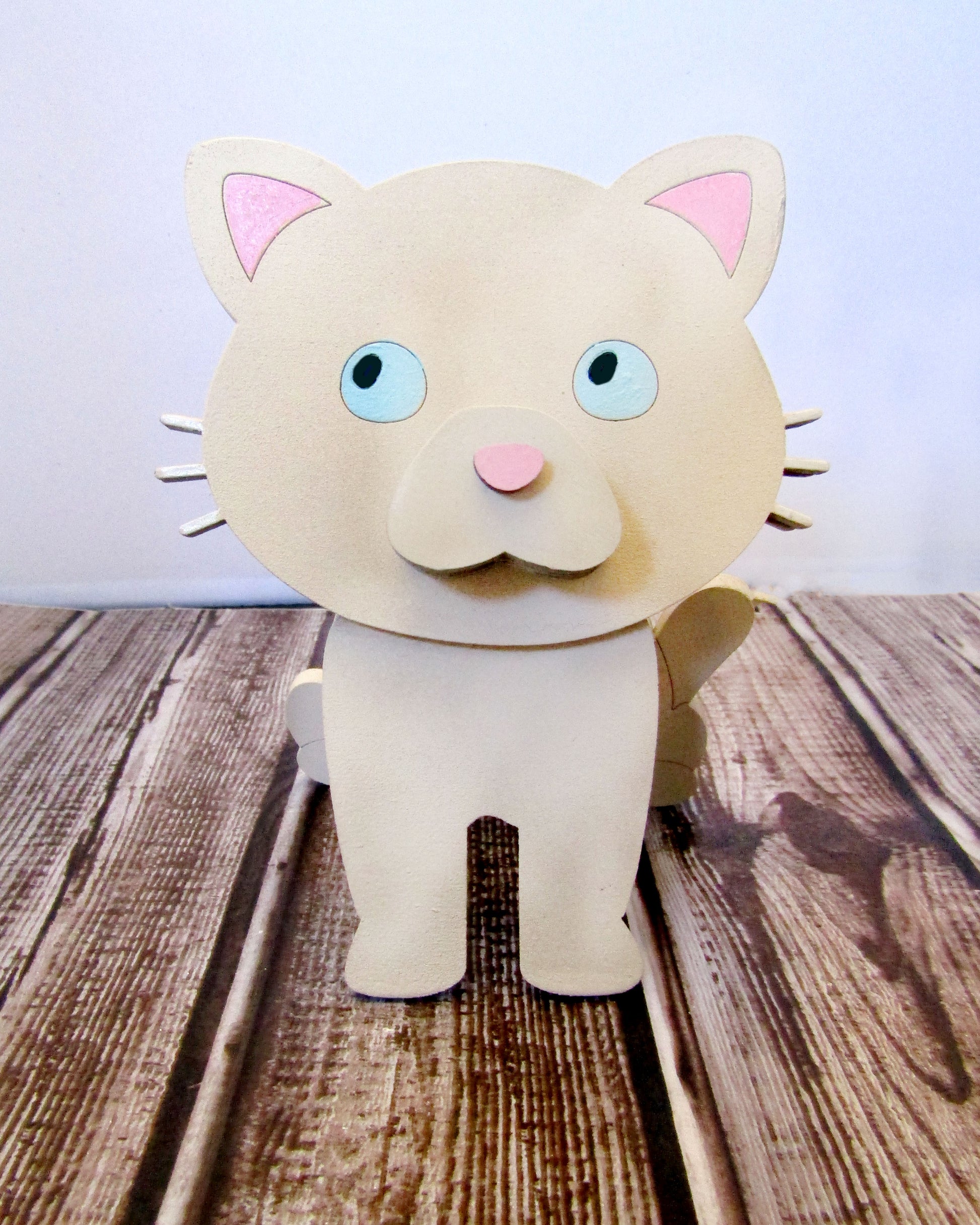 Custom-painted wooden cat glasses holder shaped like a sitting cat with eyeglasses resting on its nose. Available in black, white, orange, gray, tabby, Siamese, tuxedo, or painted from your cat's photo with optional name personalization.