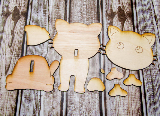 npainted wooden cat glasses holder kit featuring a sitting cat shape, ready to be painted and customized. Optional paint and brush kit available for a full DIY experience