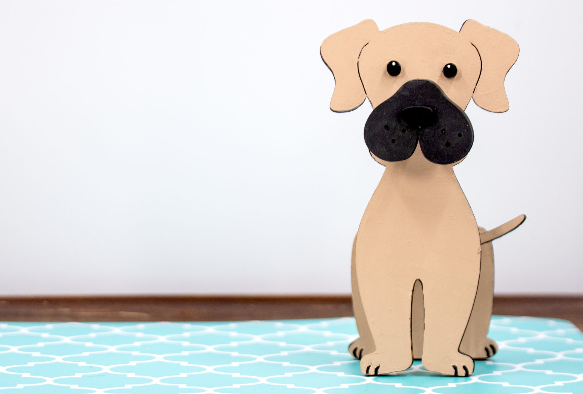 Handmade wooden glasses holder shaped like a Mastiff dog, featuring carved facial details and a sturdy snout that securely holds eyeglasses. Finished in rustic tones with optional personalization, this stand is perfect for Mastiff lovers and adds charm and function to any desk, nightstand, or shelf.