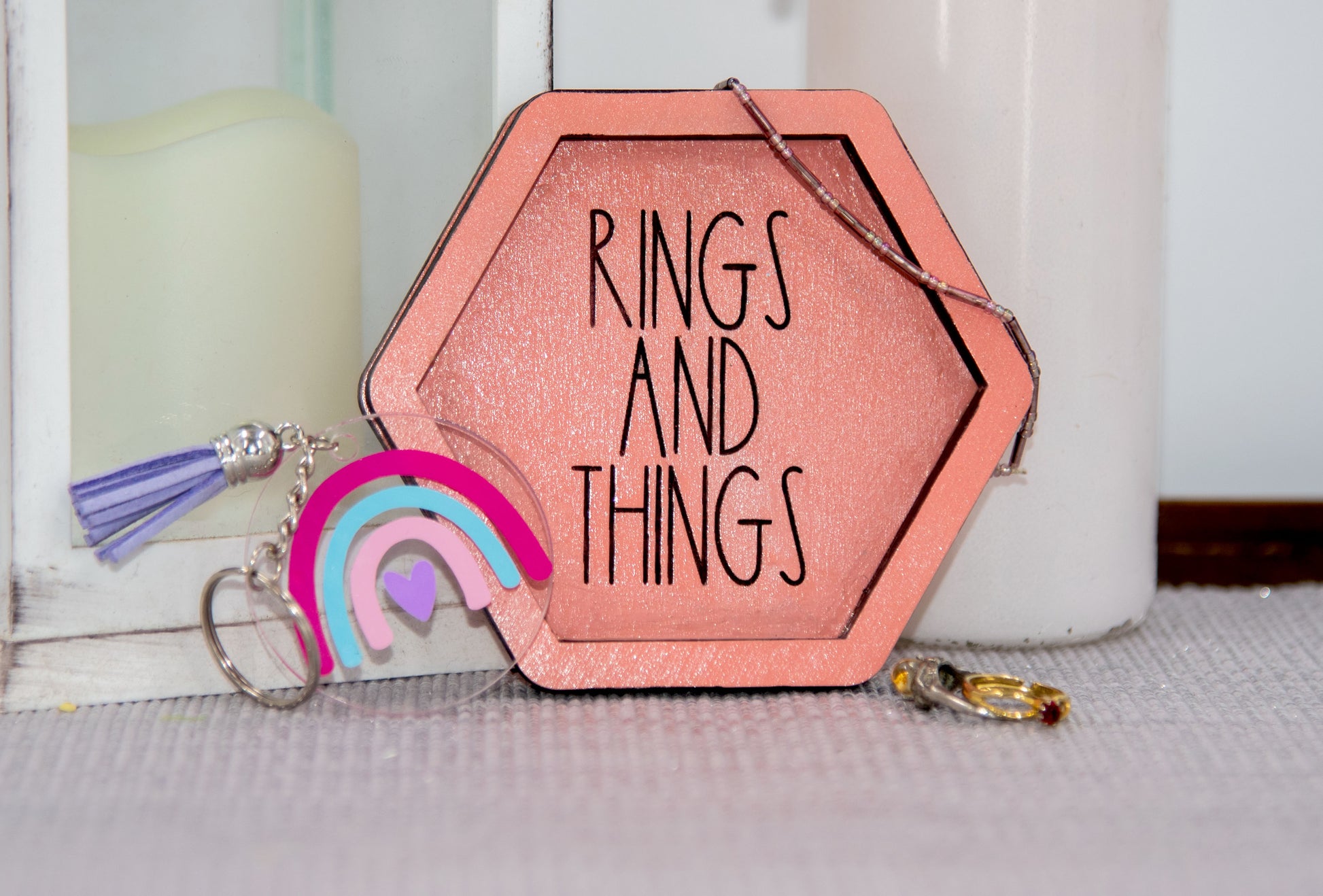 Set of small 3.75-inch round wooden trinket dishes available in various bright colors, each engraved with playful or inspiring sayings like 'Choose Happy,' 'Shit I Can’t Lose,' and 'Collect Moments Not Things.' These colorful dishes work perfectly as jewelry holders, desk catch-alls, or thoughtful gifts