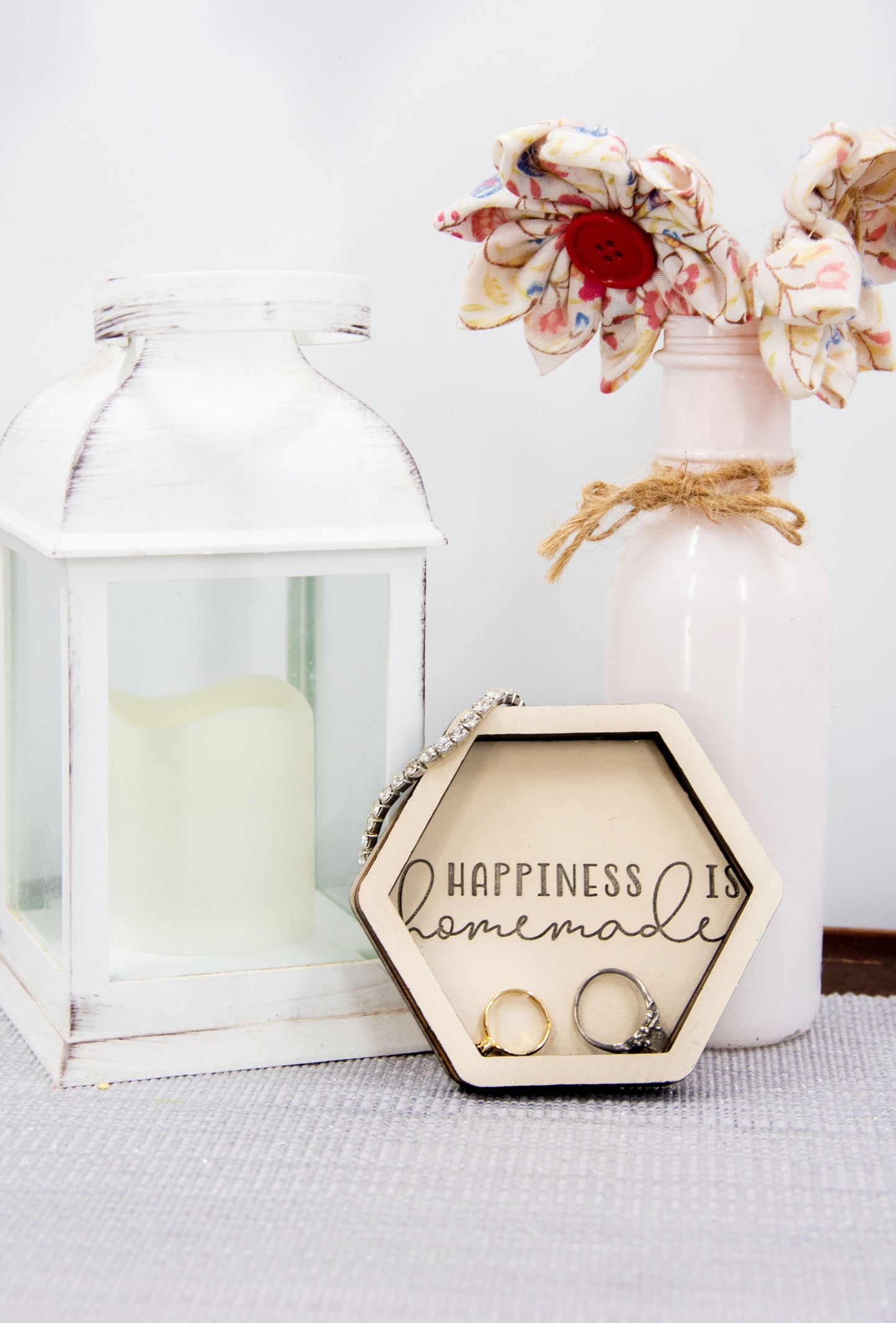 Set of small 3.75-inch round wooden trinket dishes available in various bright colors, each engraved with playful or inspiring sayings like 'Choose Happy,' 'Shit I Can’t Lose,' and 'Collect Moments Not Things.' These colorful dishes work perfectly as jewelry holders, desk catch-alls, or thoughtful gifts