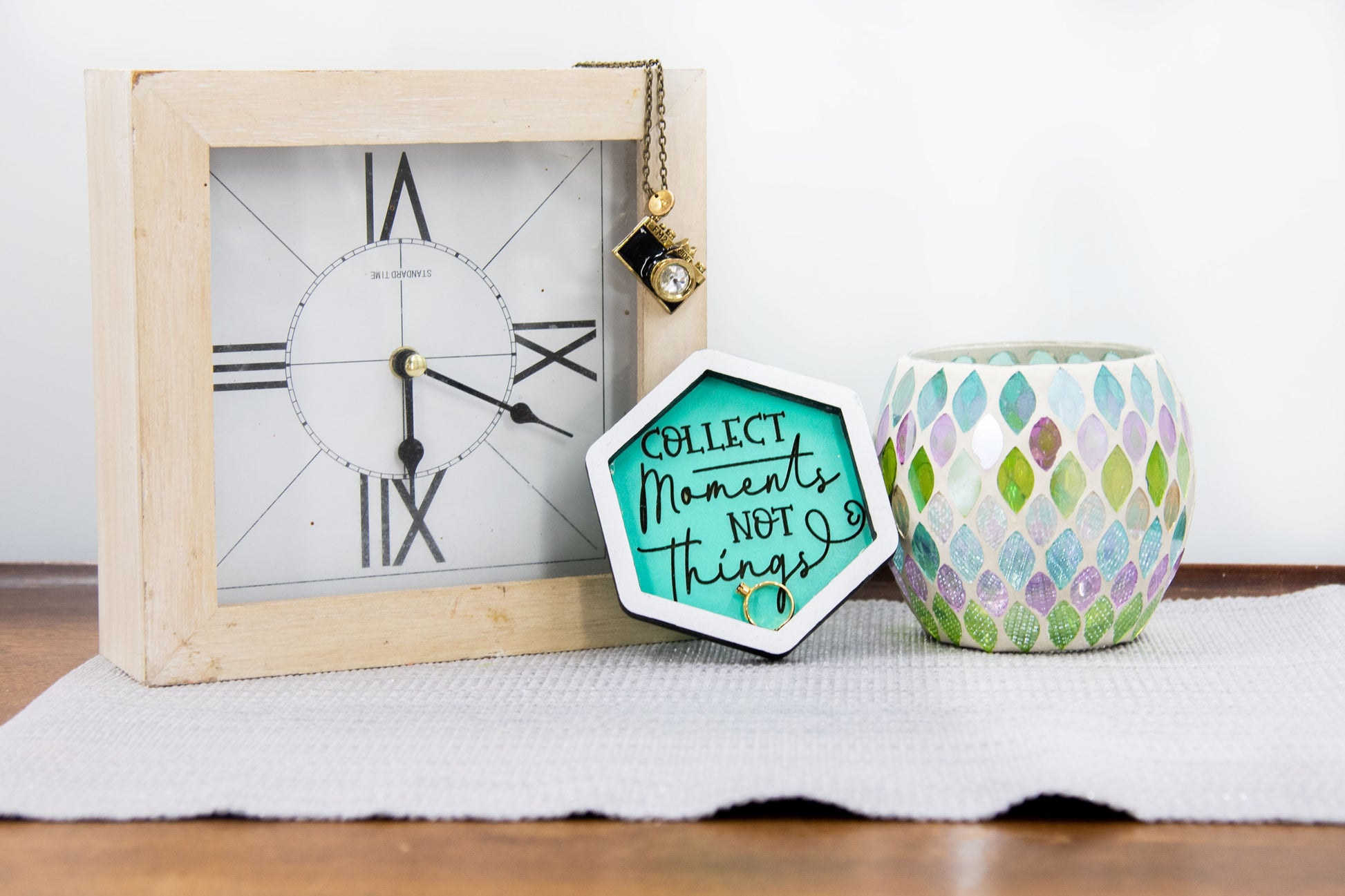 Set of small 3.75-inch round wooden trinket dishes available in various bright colors, each engraved with playful or inspiring sayings like 'Choose Happy,' 'Shit I Can’t Lose,' and 'Collect Moments Not Things.' These colorful dishes work perfectly as jewelry holders, desk catch-alls, or thoughtful gifts