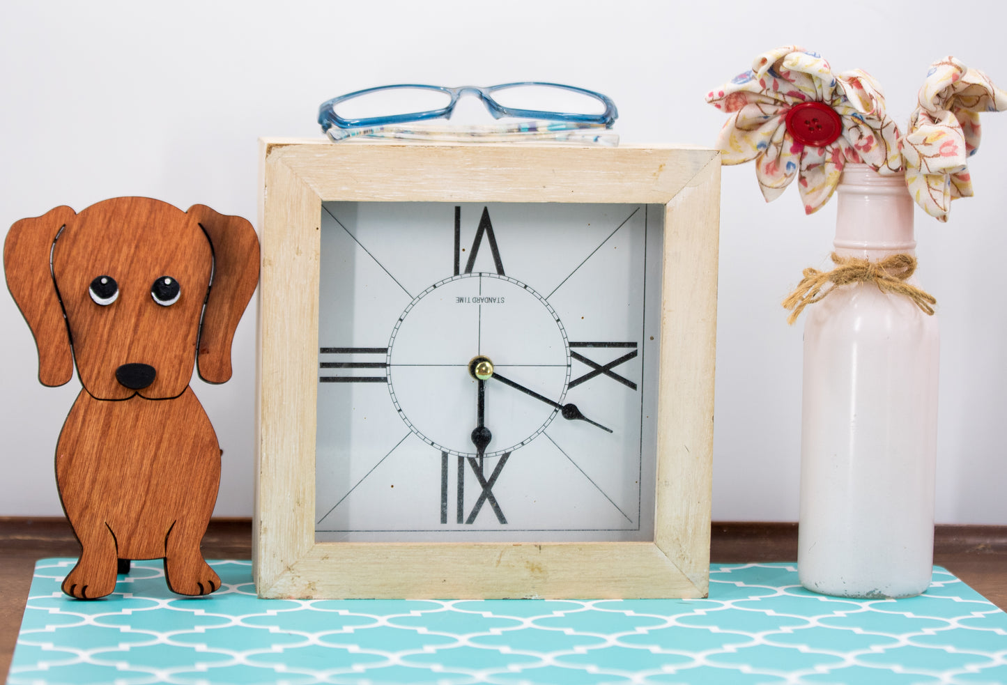 Large stained dachshund glasses holder made from solid wood, shown in red/brown finish, designed to keep eyeglasses secure while adding charm to your decor. Handmade eyeglass stand shaped like a dachshund with adorable detailing, perfect for bedside tables, desks, or as a thoughtful gift for dog lovers. Available in red/brown, black, or custom stain colors to match your style.