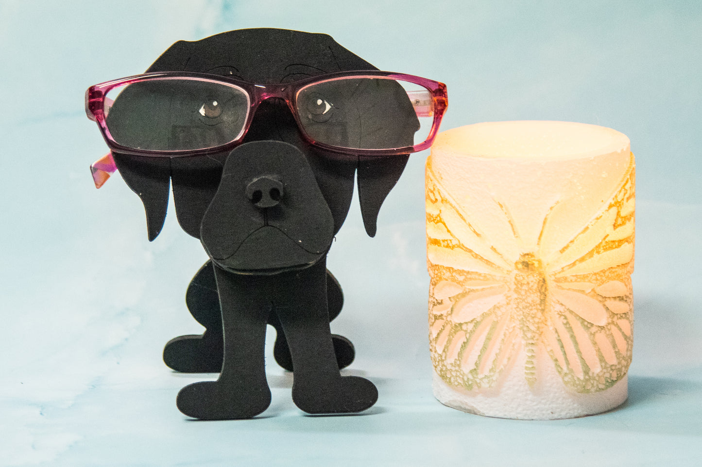 Custom handmade glasses holder shaped like a black and yellow Labrador Retriever, designed to hold eyeglasses or sunglasses. Features include a wooden build, optional DIY kit for paint-your-own fun, and an engraved nameplate for personalization. Shown assembled and with DIY parts, this functional and decorative dog-shaped