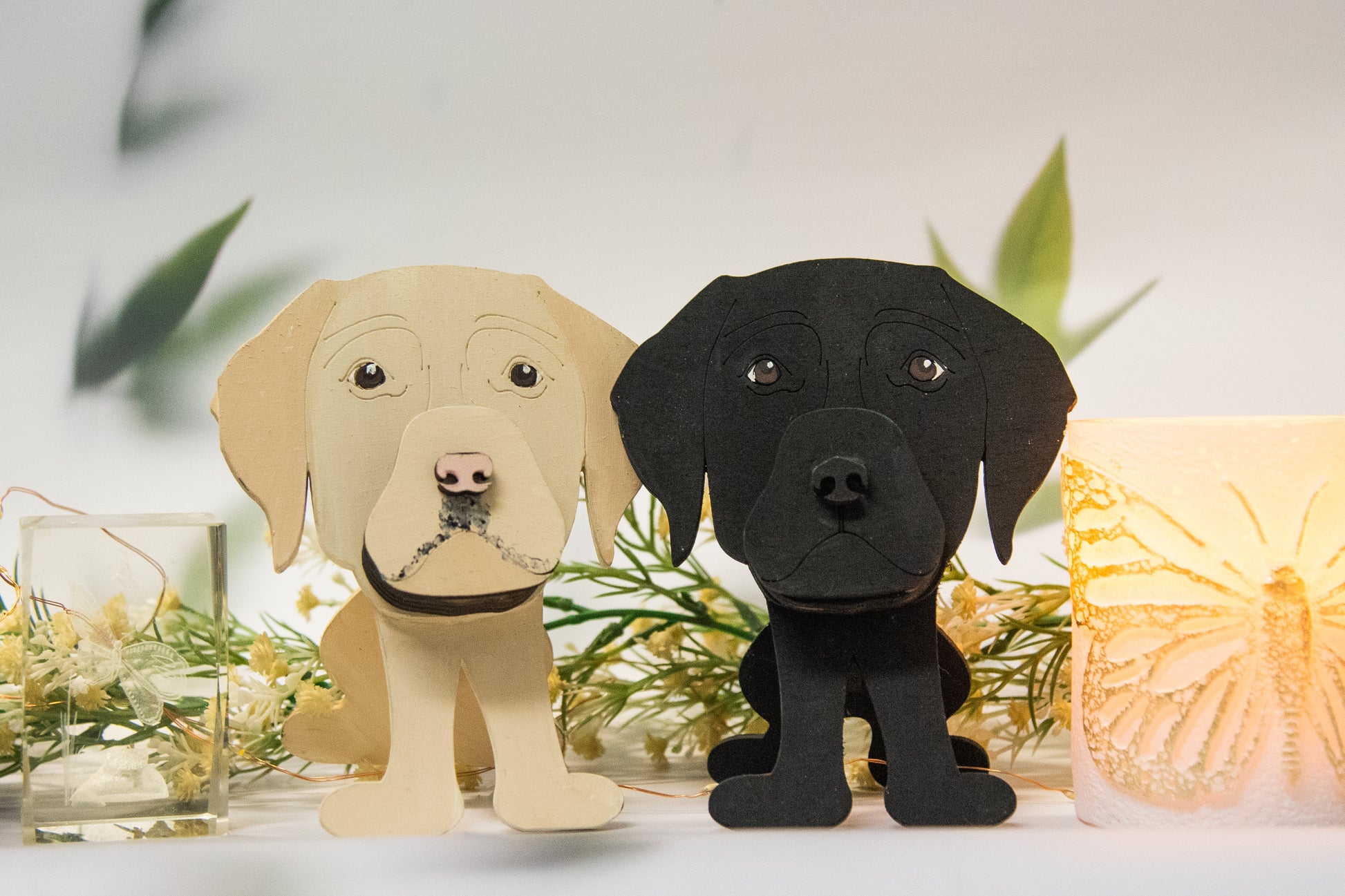 Custom handmade glasses holder shaped like a black and yellow Labrador Retriever, designed to hold eyeglasses or sunglasses. Features include a wooden build, optional DIY kit for paint-your-own fun, and an engraved nameplate for personalization. Shown assembled and with DIY parts, this functional and decorative dog-shaped