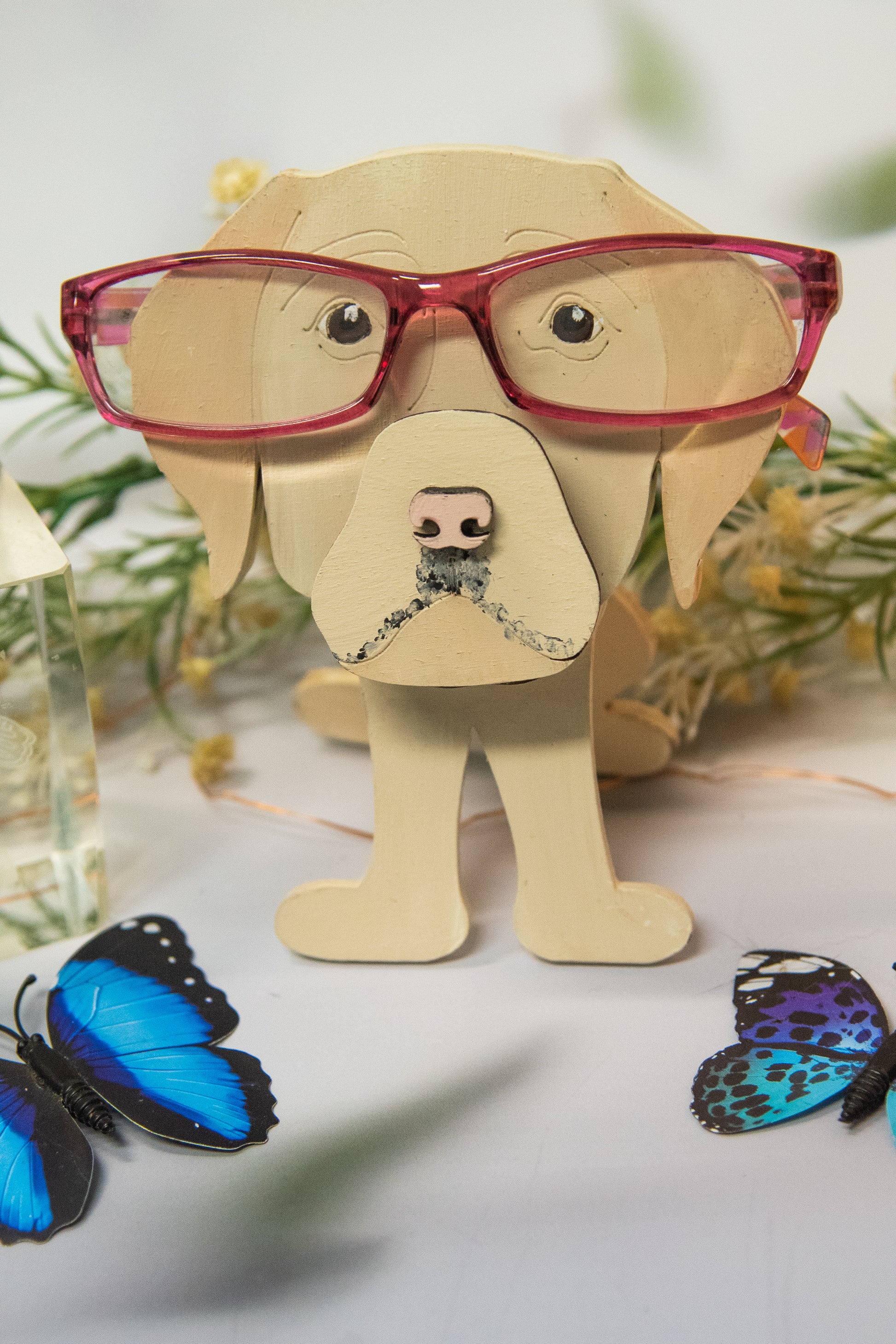 Custom handmade glasses holder shaped like a black and yellow Labrador Retriever, designed to hold eyeglasses or sunglasses. Features include a wooden build, optional DIY kit for paint-your-own fun, and an engraved nameplate for personalization. Shown assembled and with DIY parts, this functional and decorative dog-shaped