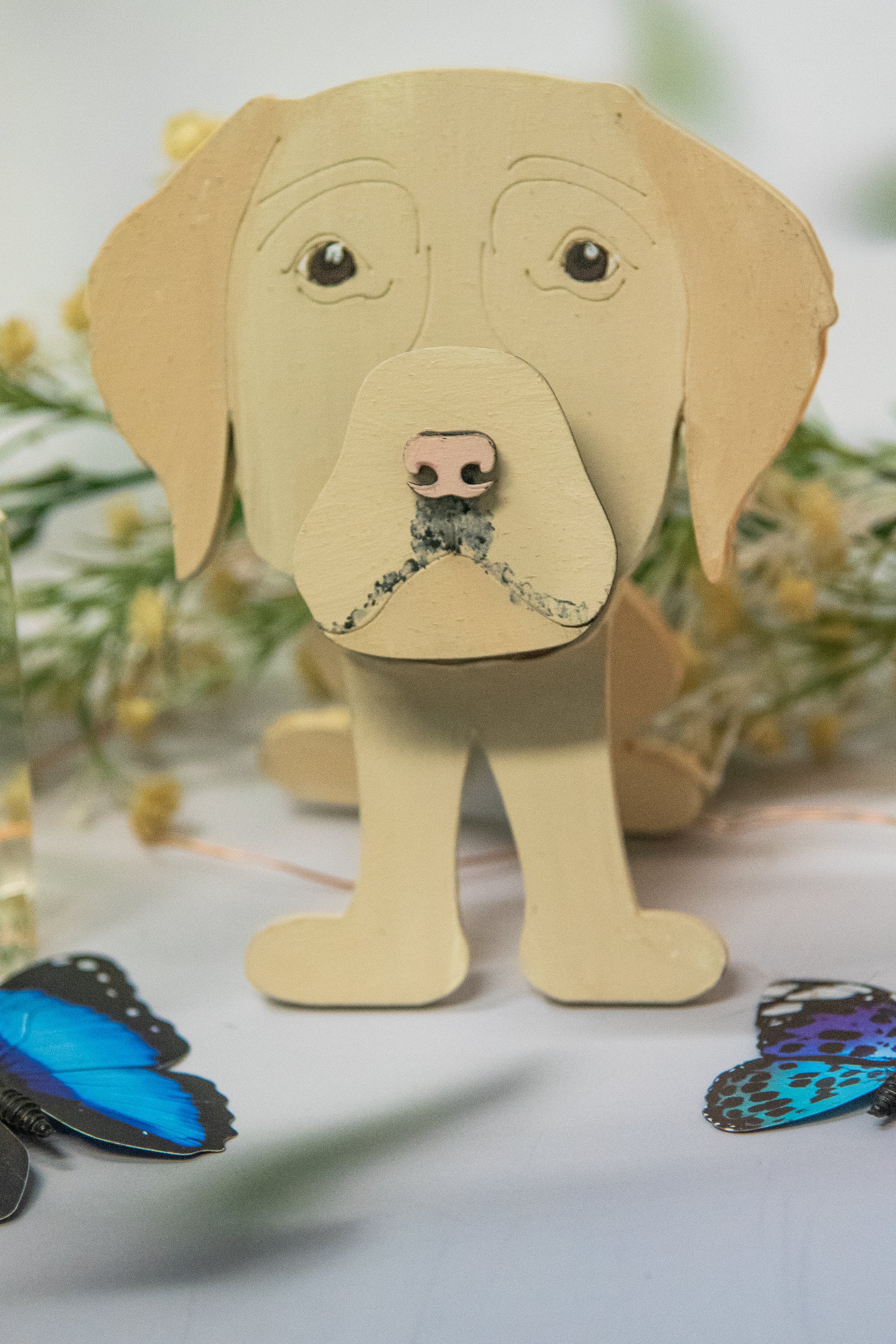 Custom handmade glasses holder shaped like a black and yellow Labrador Retriever, designed to hold eyeglasses or sunglasses. Features include a wooden build, optional DIY kit for paint-your-own fun, and an engraved nameplate for personalization. Shown assembled and with DIY parts, this functional and decorative dog-shaped