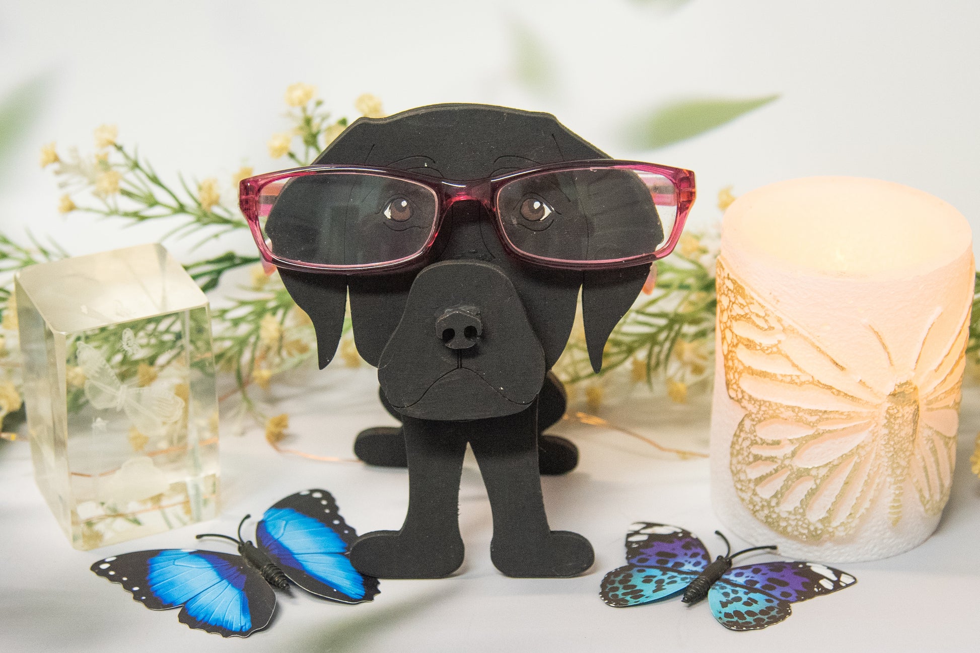 Custom handmade glasses holder shaped like a black and yellow Labrador Retriever, designed to hold eyeglasses or sunglasses. Features include a wooden build, optional DIY kit for paint-your-own fun, and an engraved nameplate for personalization. Shown assembled and with DIY parts, this functional and decorative dog-shaped