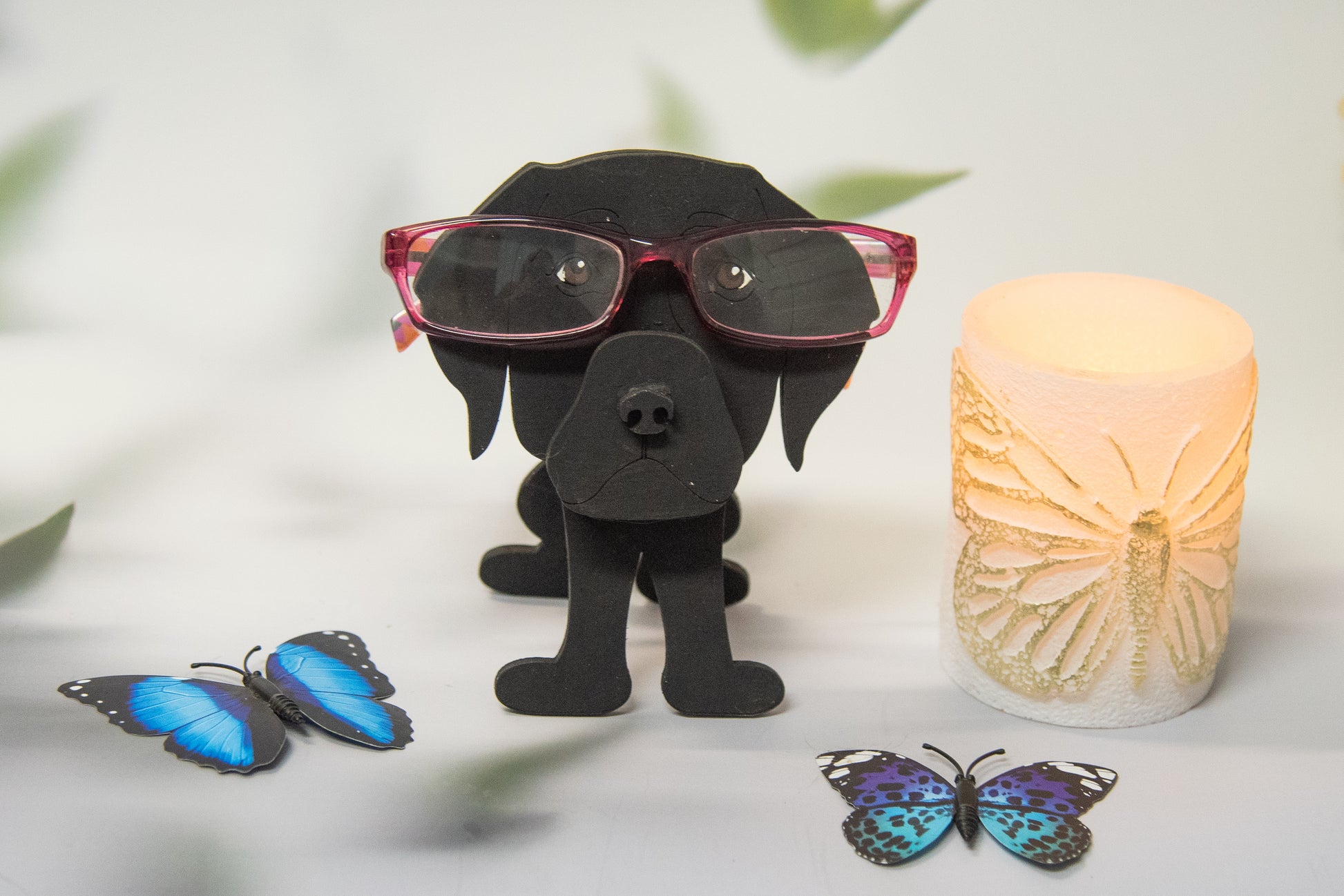 Custom handmade glasses holder shaped like a black and yellow Labrador Retriever, designed to hold eyeglasses or sunglasses. Features include a wooden build, optional DIY kit for paint-your-own fun, and an engraved nameplate for personalization. Shown assembled and with DIY parts, this functional and decorative dog-shaped