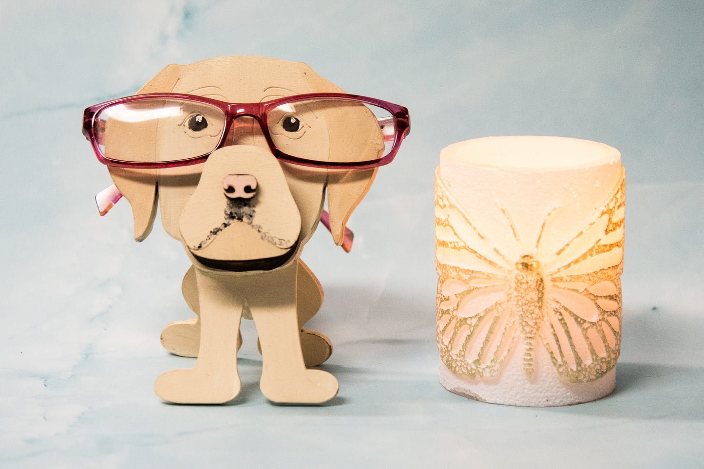 Custom handmade glasses holder shaped like a black and yellow Labrador Retriever, designed to hold eyeglasses or sunglasses. Features include a wooden build, optional DIY kit for paint-your-own fun, and an engraved nameplate for personalization. Shown assembled and with DIY parts, this functional and decorative dog-shaped