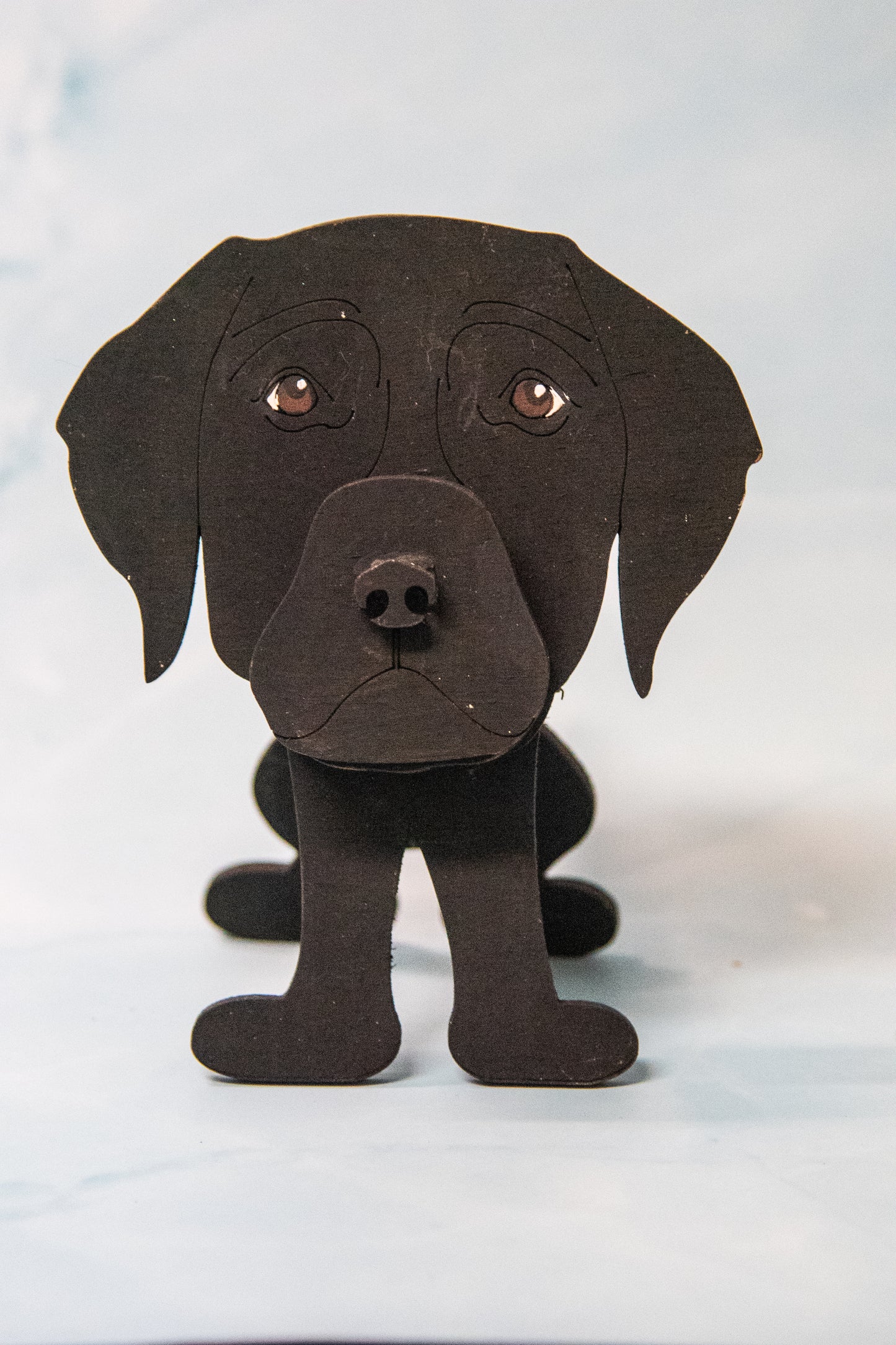 Custom handmade glasses holder shaped like a black and yellow Labrador Retriever, designed to hold eyeglasses or sunglasses. Features include a wooden build, optional DIY kit for paint-your-own fun, and an engraved nameplate for personalization. Shown assembled and with DIY parts, this functional and decorative dog-shaped