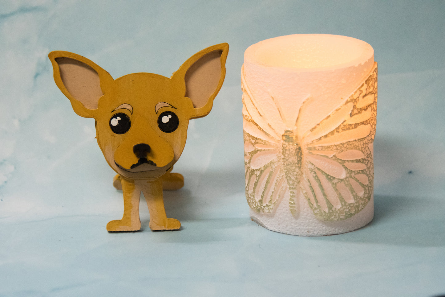 Hand-painted wooden chihuahua glasses holder shaped like a small standing dog, designed to hold eyeglasses securely on its nose. Features custom-painted colors like black, tan, or white. Functional dog decor that works as an eyeglass organizer for pet lovers, dog moms, or anyone who adores their chihuahua. Made from wood and painted by hand with charming detail, ideal for display on desks, nightstands, or bookshelves.