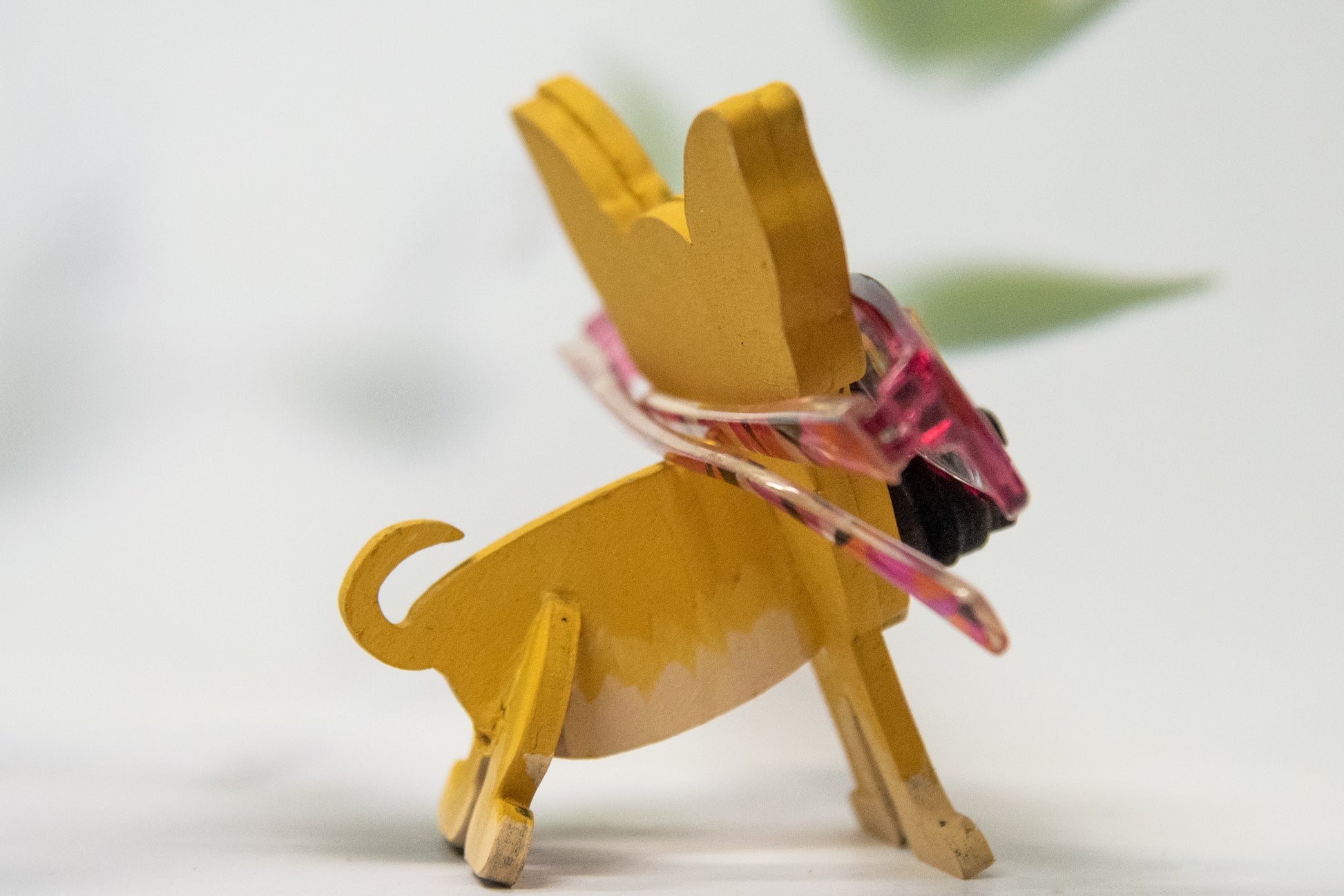Hand-painted wooden chihuahua glasses holder shaped like a small standing dog, designed to hold eyeglasses securely on its nose. Features custom-painted colors like black, tan, or white. Functional dog decor that works as an eyeglass organizer for pet lovers, dog moms, or anyone who adores their chihuahua. Made from wood and painted by hand with charming detail, ideal for display on desks, nightstands, or bookshelves.