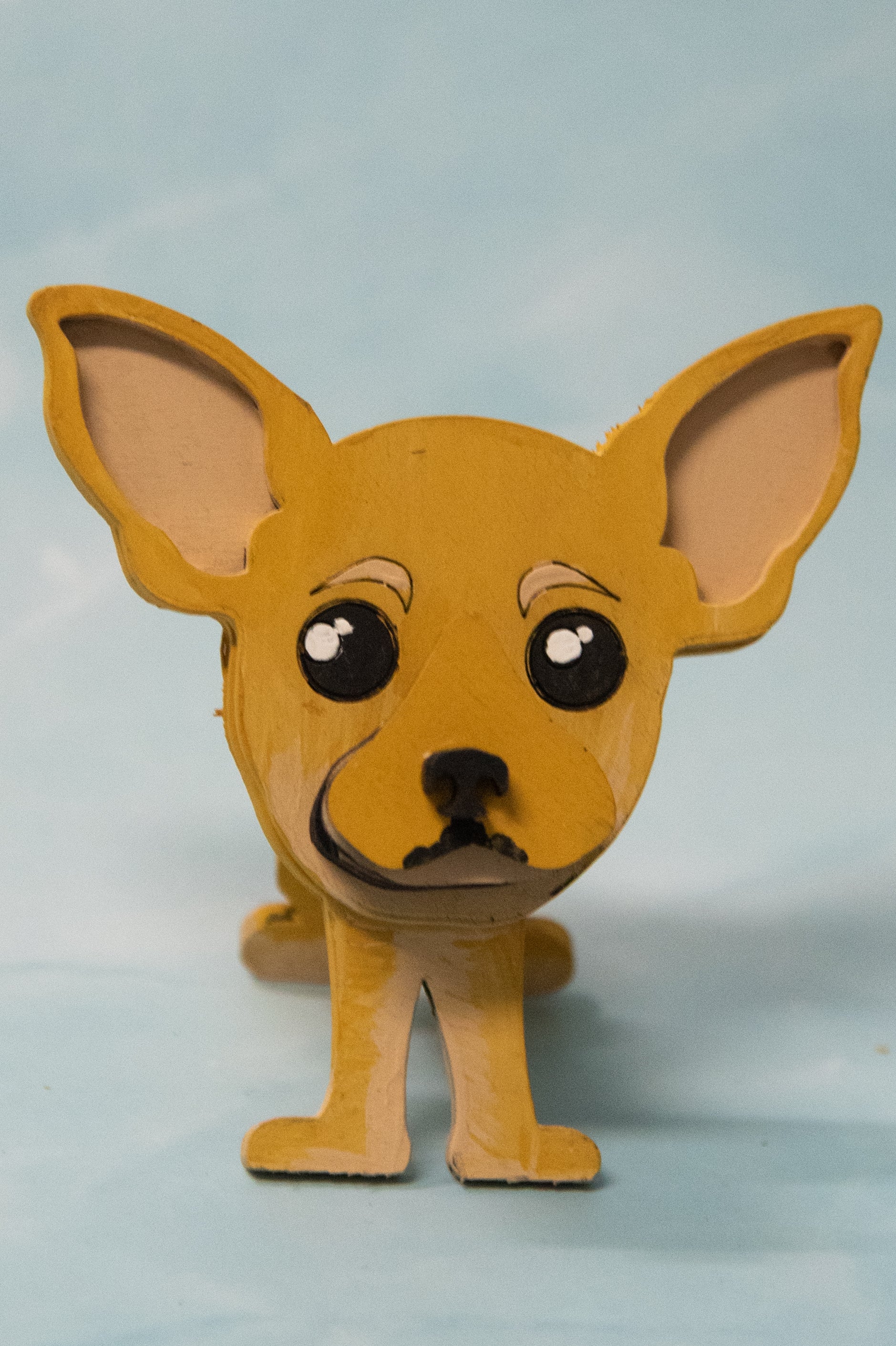 Hand-painted wooden chihuahua glasses holder shaped like a small standing dog, designed to hold eyeglasses securely on its nose. Features custom-painted colors like black, tan, or white. Functional dog decor that works as an eyeglass organizer for pet lovers, dog moms, or anyone who adores their chihuahua. Made from wood and painted by hand with charming detail, ideal for display on desks, nightstands, or bookshelves.