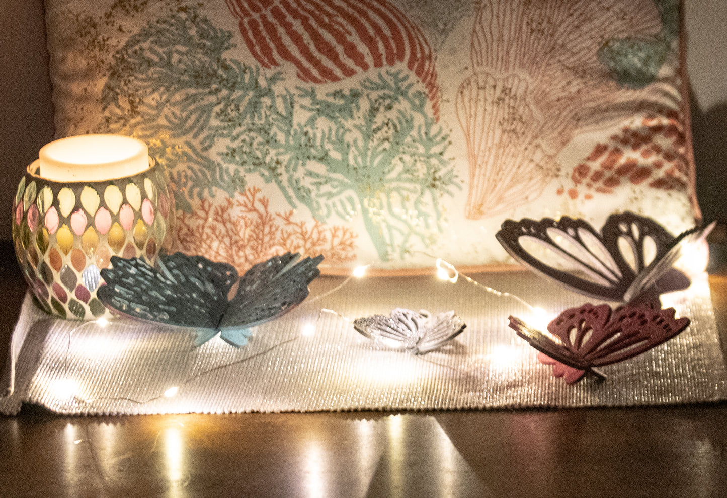 Finished 3D butterfly shelf sitter with two layers of wood, patterned top layer, hand painted in custom colors, standing on a shelf or tray as whimsical spring or seasonal decor accent.