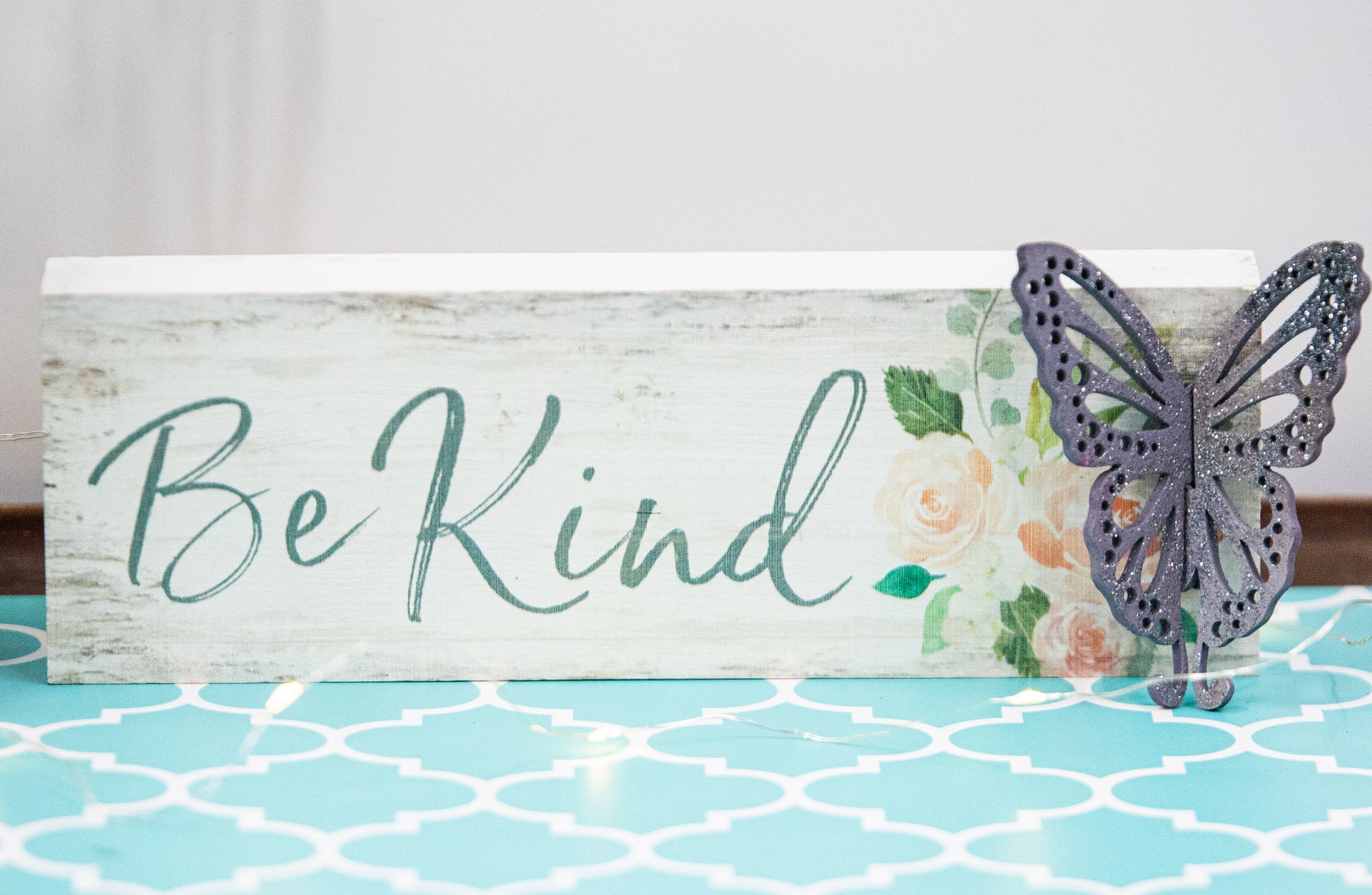 Finished 3D butterfly shelf sitter with two layers of wood, patterned top layer, hand painted in custom colors, standing on a shelf or tray as whimsical spring or seasonal decor accent.