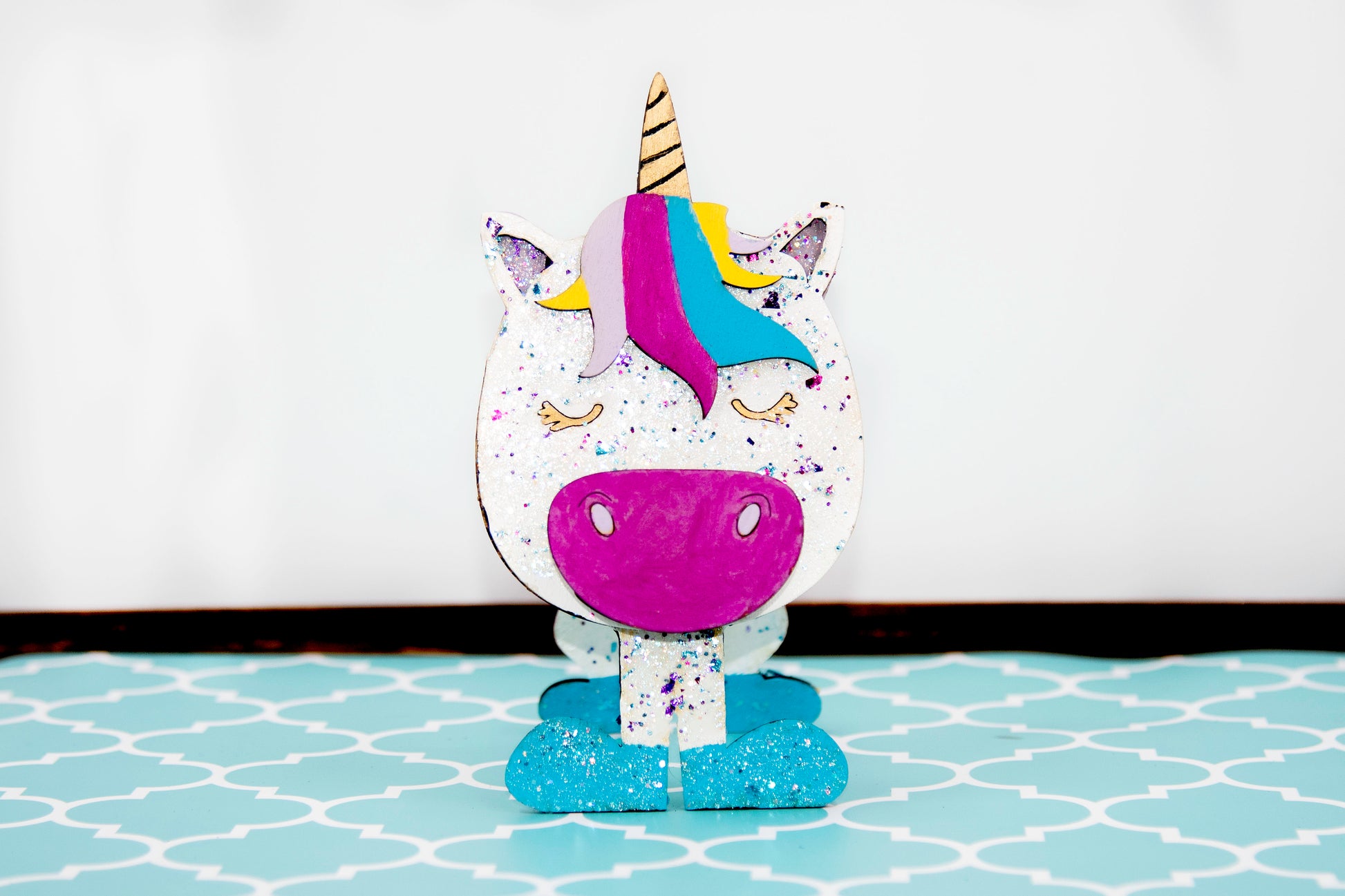 Handmade wooden unicorn glasses stand in whimsical pastel colors, a unique and magical eyeglass holder for desks, dressers, or kids' rooms, perfect as a gift for unicorn lovers or fantasy-themed decor.
