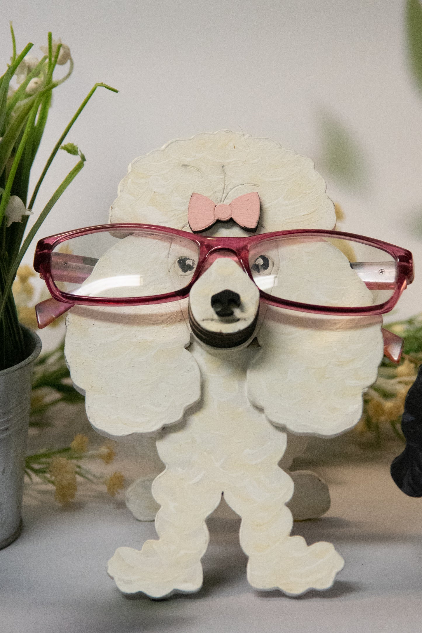 Handcrafted wooden poodle glasses holder stand in standard or miniature poodle shape, with optional bow detail, shown in black and white but fully customizable, unique dog lover gift
