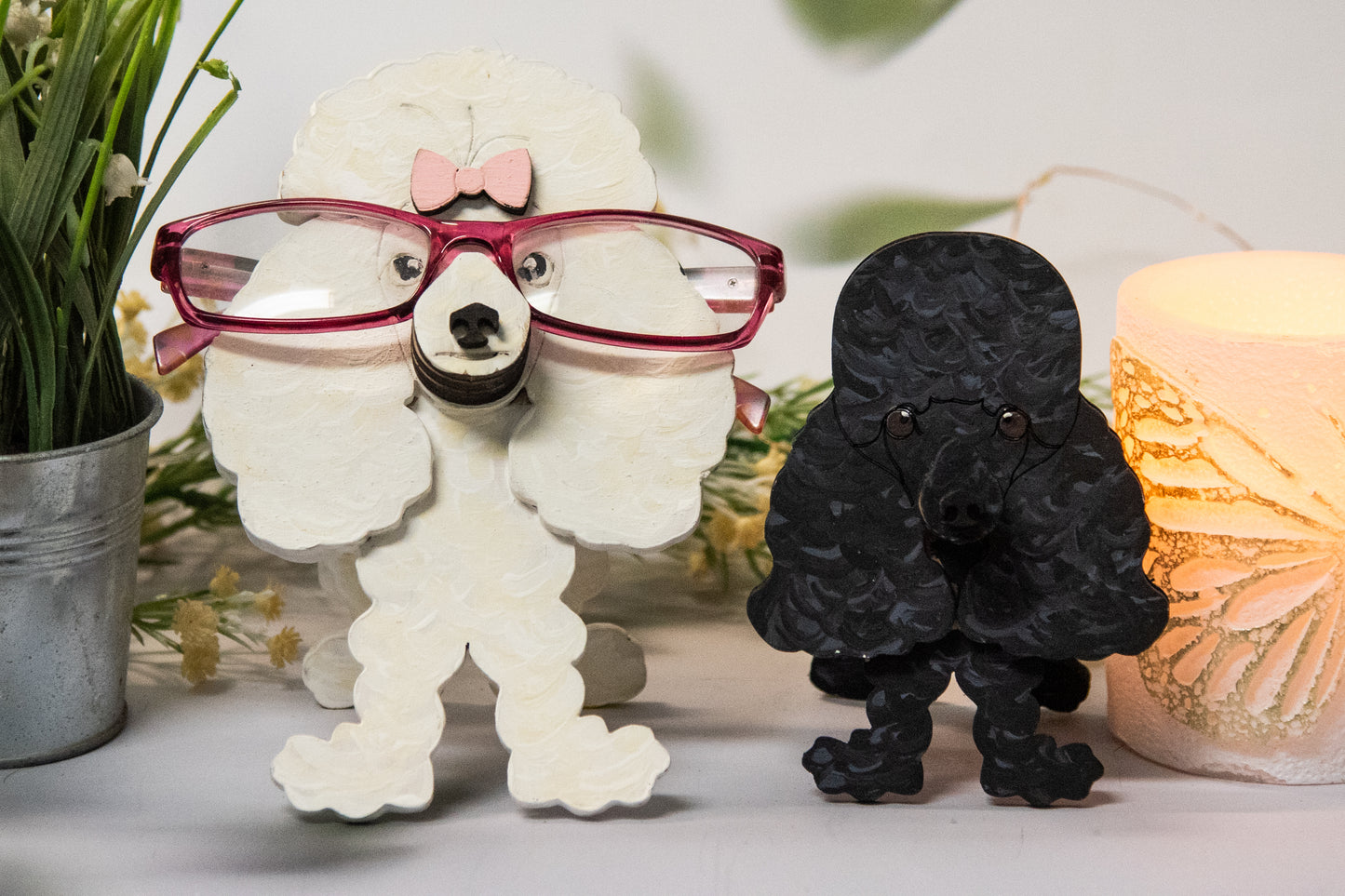 Handcrafted wooden poodle glasses holder stand in standard or miniature poodle shape, with optional bow detail, shown in black and white but fully customizable, unique dog lover gift
