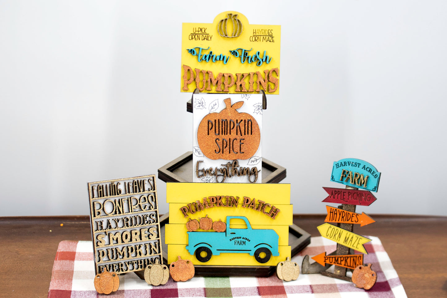 Pumpkin Patch Tiered Tray Set featuring 6 wooden fall decor pieces including pumpkin signs, hayride accents, and rustic autumn colors. Perfect for farmhouse style tiered trays, cozy fall shelf sitters, table decor, or entryway setups. Customizable colors available. Handmade rustic fall home decor that makes a beautiful seasonal accent or unique gift for autumn lovers. Finished version shown ready to display.