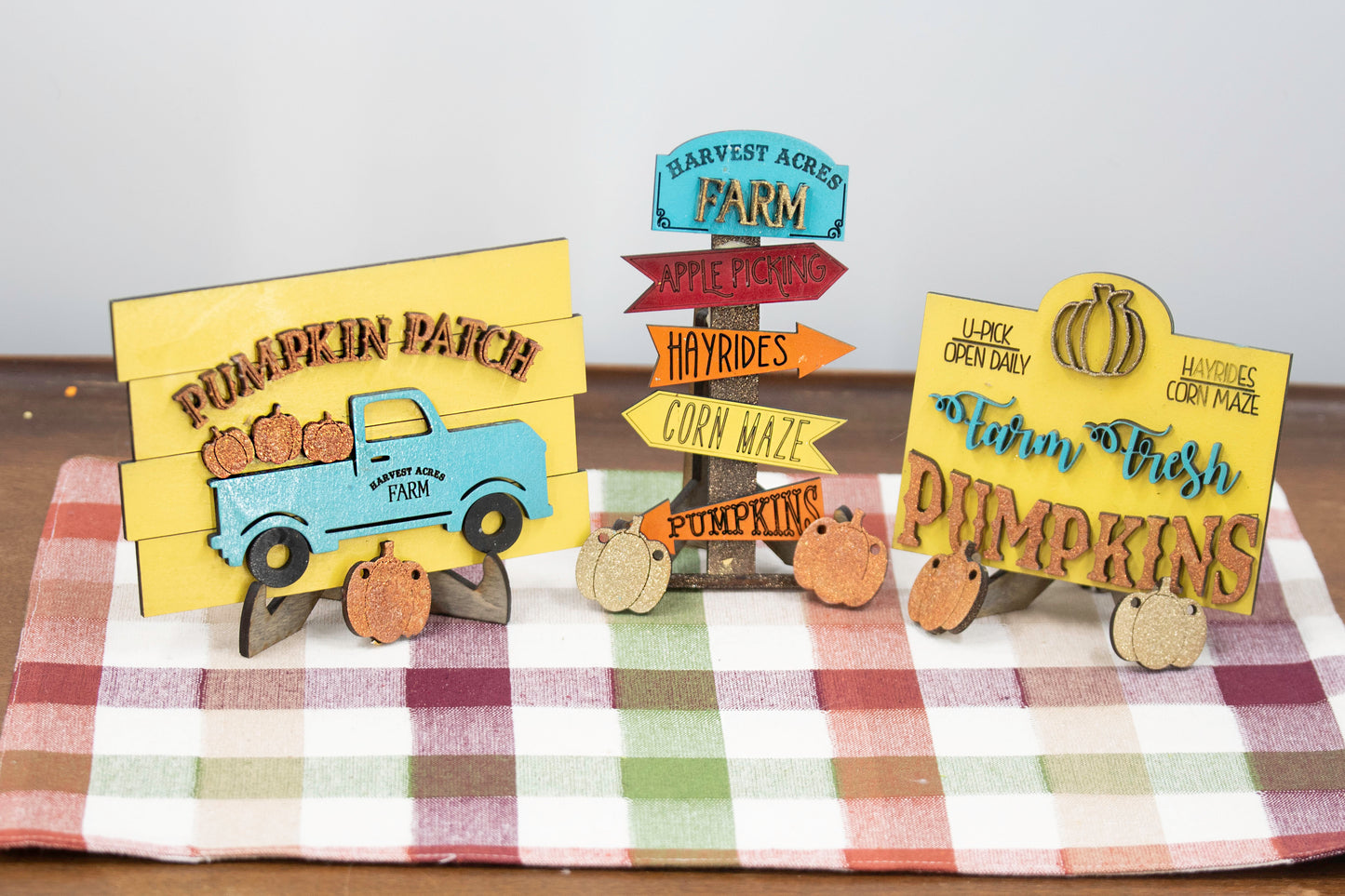 Pumpkin Patch Tiered Tray Set featuring 6 wooden fall decor pieces including pumpkin signs, hayride accents, and rustic autumn colors. Perfect for farmhouse style tiered trays, cozy fall shelf sitters, table decor, or entryway setups. Customizable colors available. Handmade rustic fall home decor that makes a beautiful seasonal accent or unique gift for autumn lovers. Finished version shown ready to display.