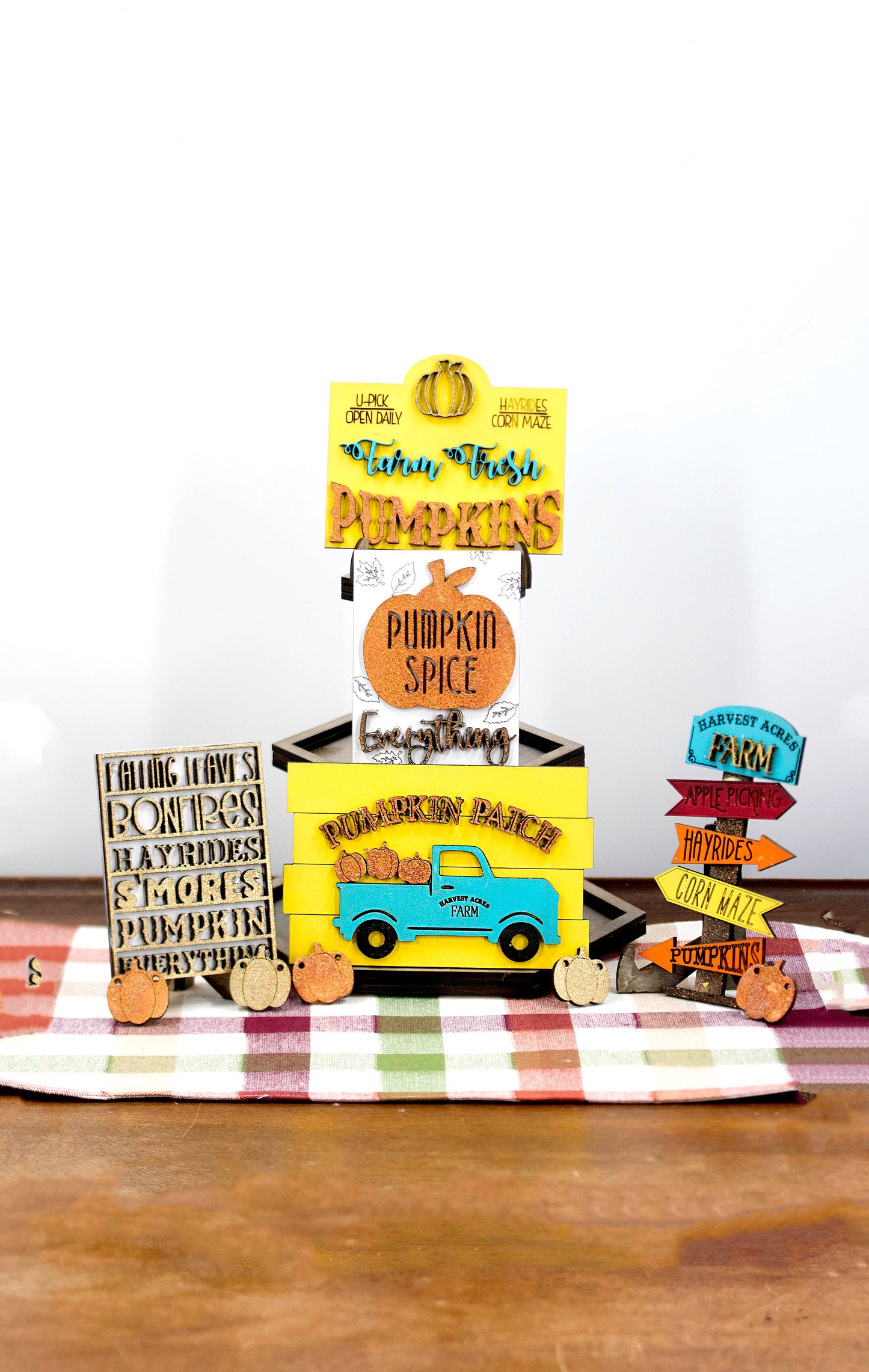 Pumpkin Patch Tiered Tray Set featuring 6 wooden fall decor pieces including pumpkin signs, hayride accents, and rustic autumn colors. Perfect for farmhouse style tiered trays, cozy fall shelf sitters, table decor, or entryway setups. Customizable colors available. Handmade rustic fall home decor that makes a beautiful seasonal accent or unique gift for autumn lovers. Finished version shown ready to display.
