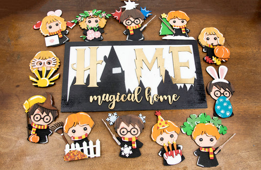 Full view of handcrafted wizard-themed interchangeable wooden sign that reads 'Home Magical Home' with wizard silhouettes forming the letter O, displayed on a shelf with all 12 hand-painted seasonal pieces including pumpkin, snowflake, shamrock, heart, sun, watermelon, leaf, ornament, egg, flower, flag, and candy corn — perfect for year-round magical home decor, Harry Potter-inspired, fantasy cottagecore aesthetic, unique seasonal gift for wizard fans and DIY crafters